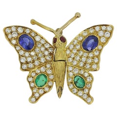 Broche papillon vintage saphir, émeraude et diamant