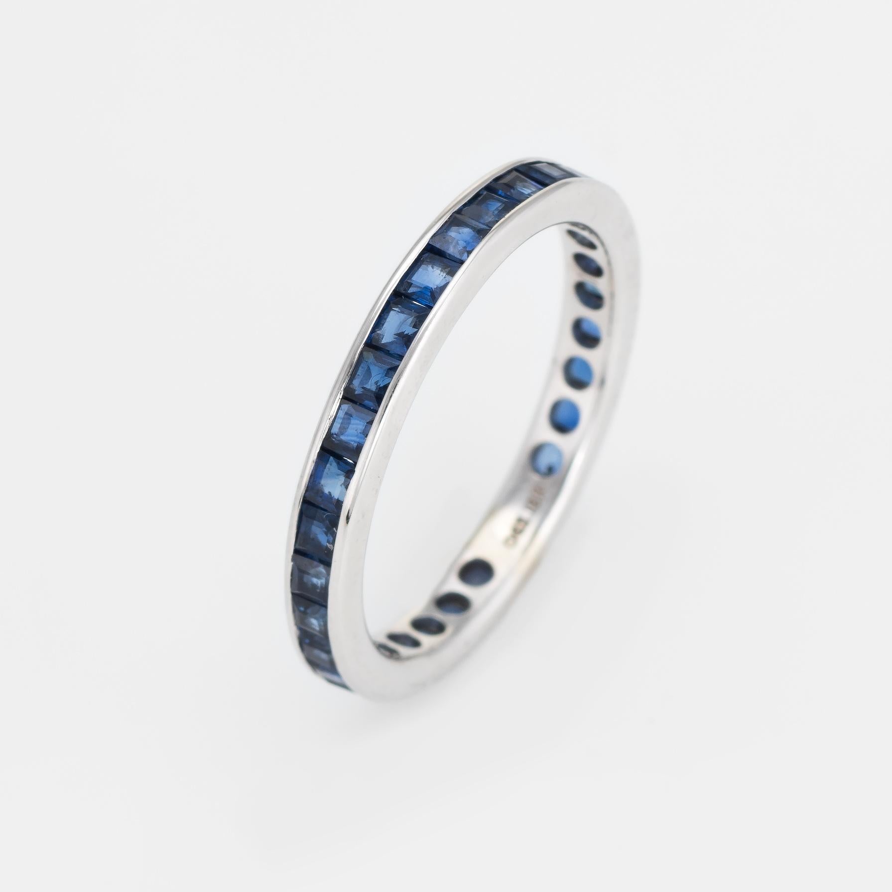 Elegant sapphire eternity ring, crafted in 18 karat white gold. 

26 square cut blue sapphires are estimated at 0.02 carats each and total an estimated 0.56 carats. The sapphires are in excellent condition and free of cracks or chips.

The ring
