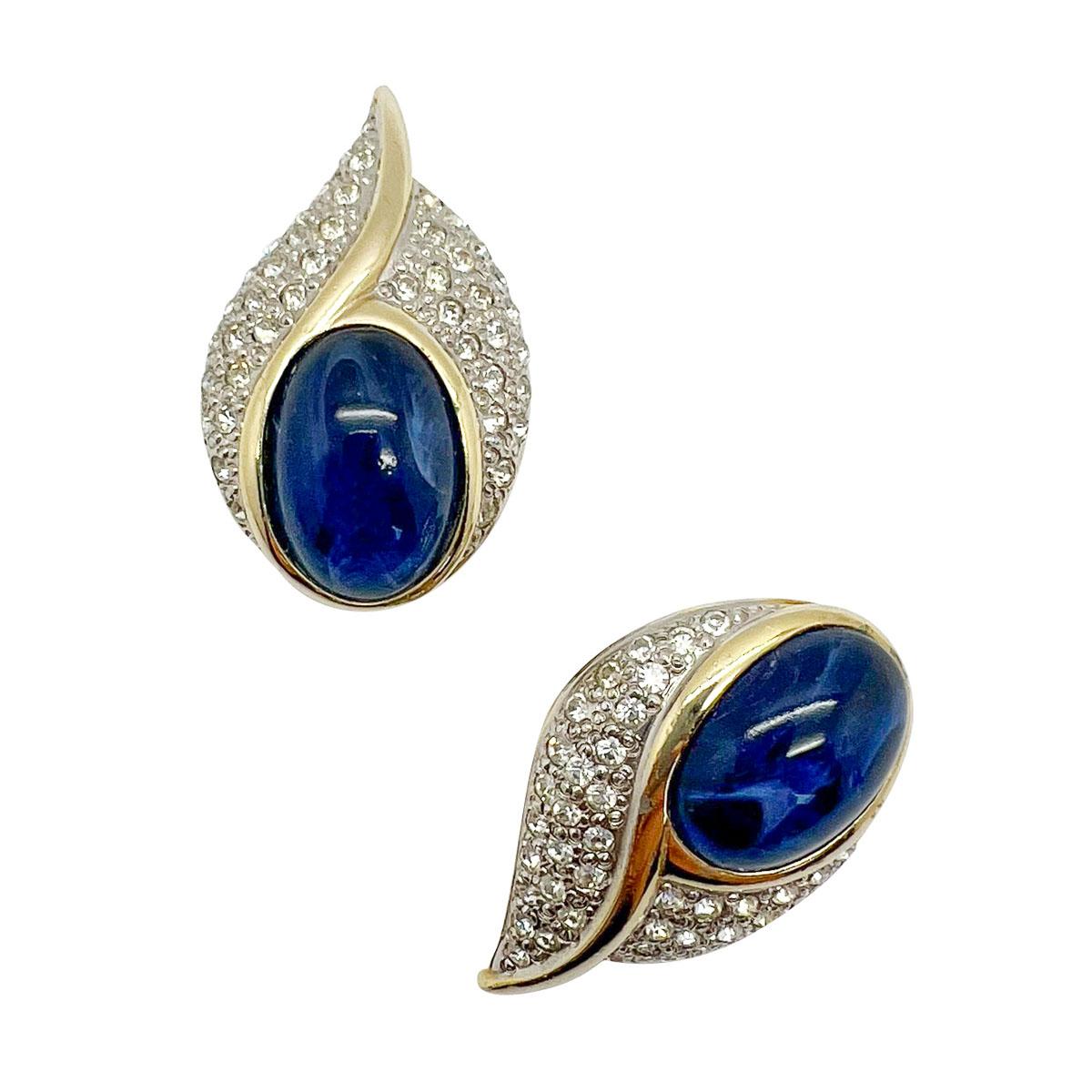 Adorable Vintage Sapphire Cabochon Earrings. The huge oval cabochon stone emulating a flawed sapphire with its silk inclusions, surround by pave set chatons in an exquisitely designed twist style mount. Sumptuous vintage that will be forever your
