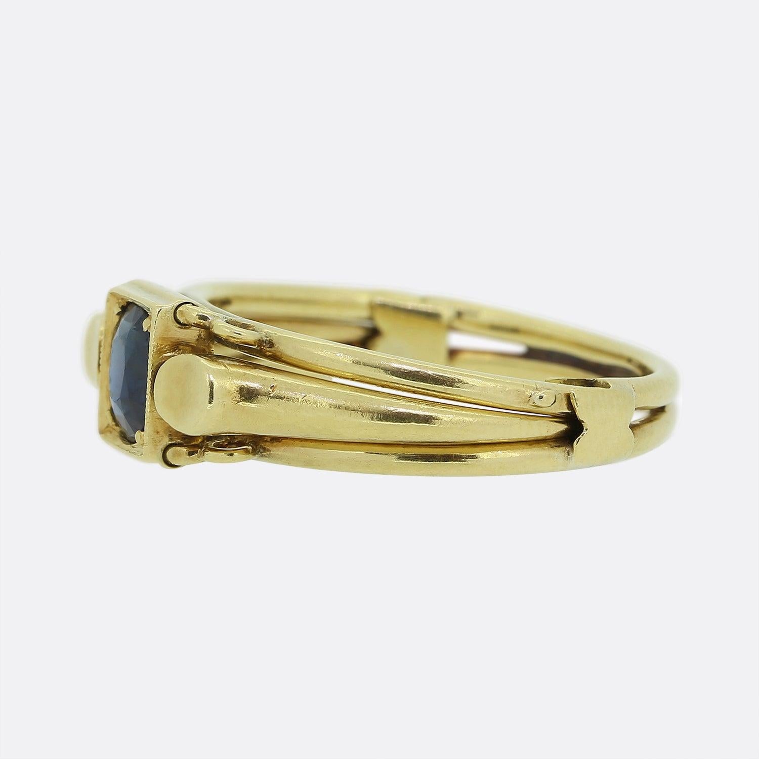 Here we have a sophisticated openable band ring which comes with a hinged closure giving it an eye-catching appeal. A single oval shaped sapphire possessing rich royal blue colour tone sits at the centre of the face in between a trio of yellow gold
