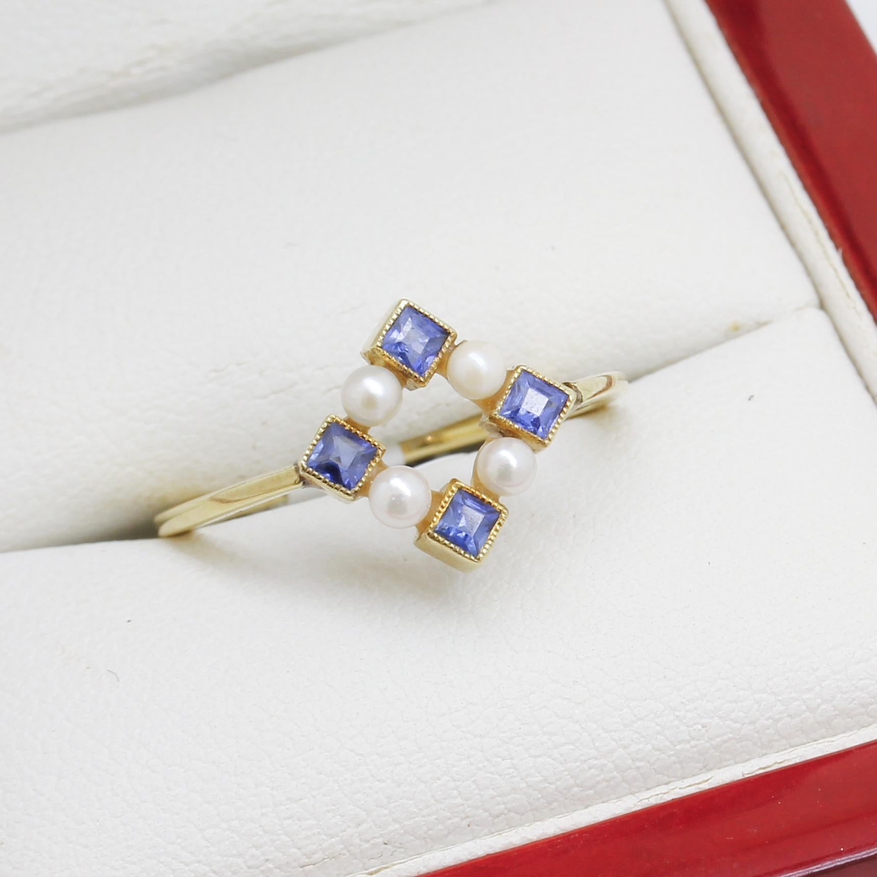 Mix of 18ct & 14ct Yellow gold
4 Princess Sapphires 2 x 2mm
4 Pearls  2.5mm dia
Item Weight: 2.46g
Size - O (Can be resized)