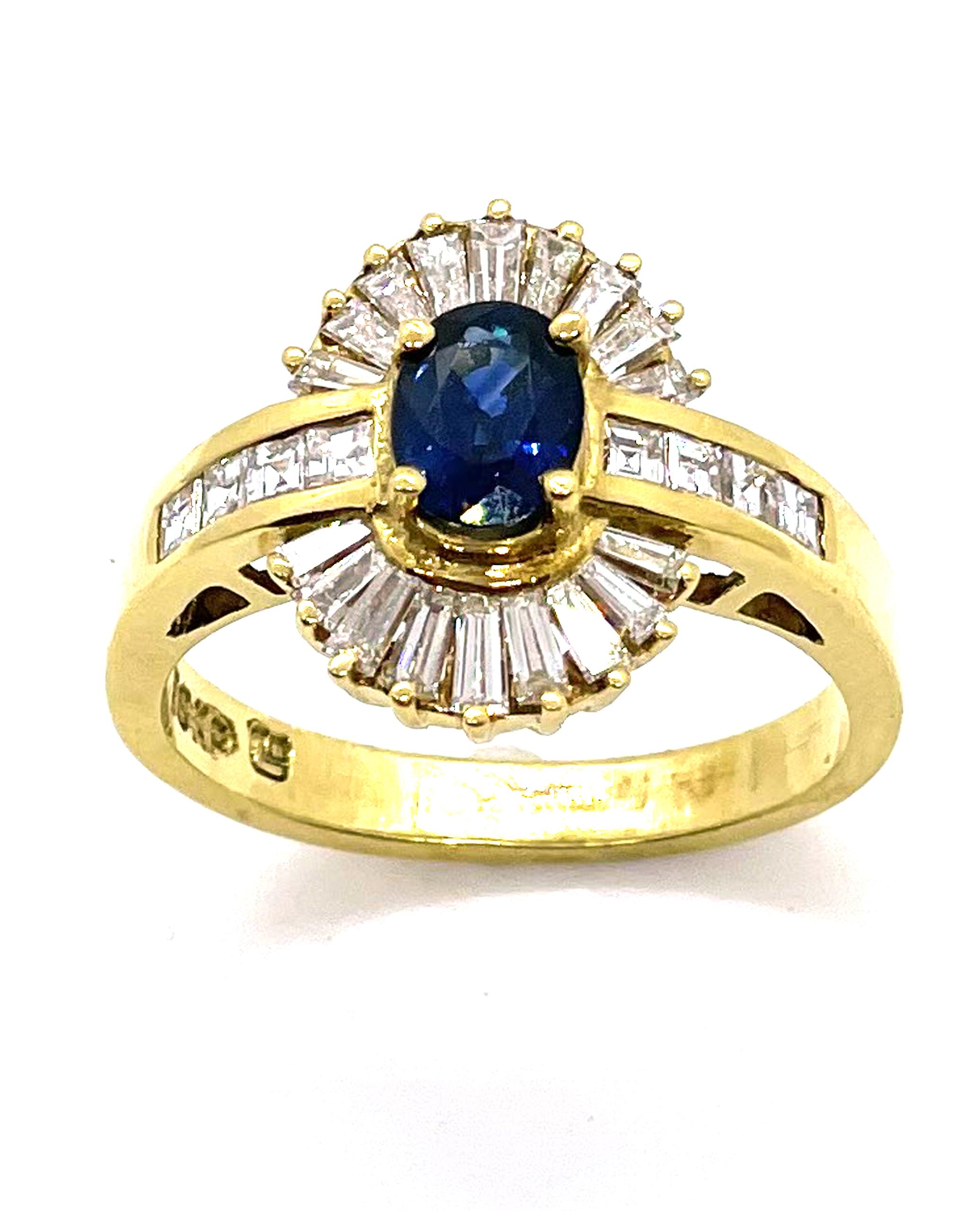 Vintage 18K yellow gold ring with one oval sapphire 0.77 carats and 8 asscher cut diamonds and 18 baguette diamonds totaling 1.00 carats. (F/G color, VS clarity)

- Created circa 1985
- Finger size 6.5