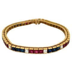 Bracelet vintage en or jaune 18 carats avec saphirs, rubis et diamants