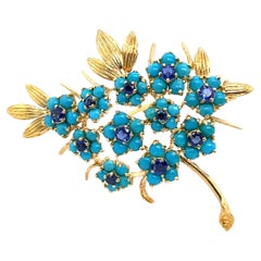 Spilla vintage in zaffiro e turchese, incastonata in oro giallo 18 ct.