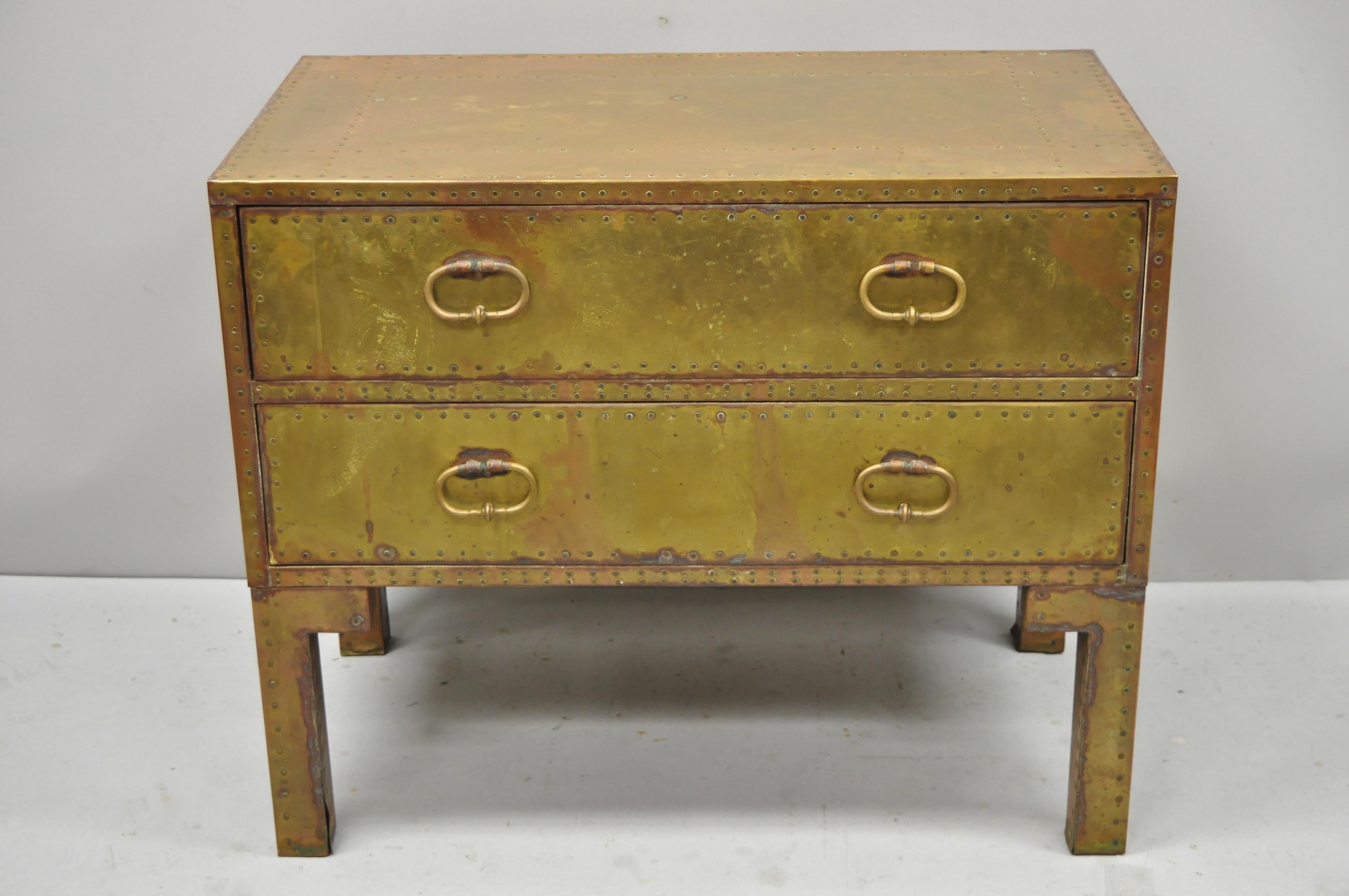 Vintage Sarreid brass studded English Campaign style two-drawer chest. Item features brass wrapped solid wood frame, original label, 2 dovetailed drawers, quality craftsmanship, great style and form, circa mid to late 20th century. Measurements: 28