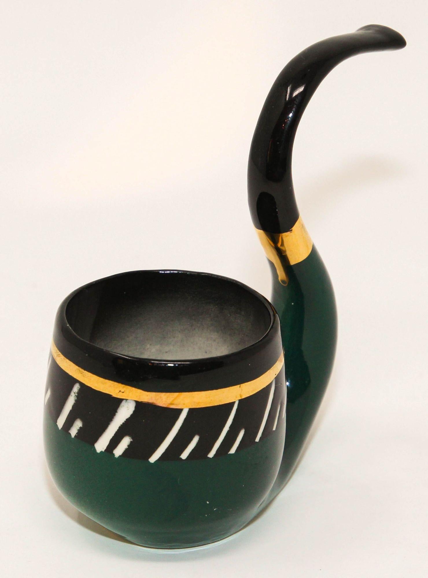 Sascha Brastoff Art Studio Ceramic midcentury Art Pottery, Circa 1950s.
Vintage Mid-Century Modern Sascha Bradstoff Ceramic ashtray or cigarette holder in the shape of a pipe.
Sascha Brastoff unusual black, green and gold ceramic