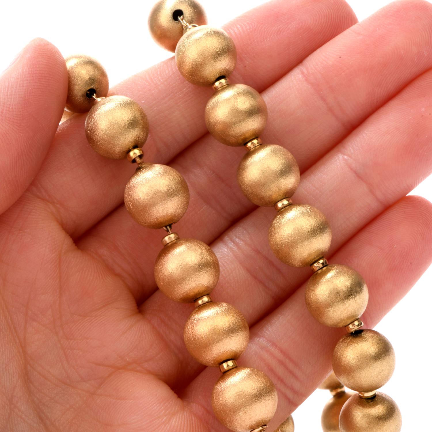This 17.25 Inch 14 karat gold bead necklace offers a compliment

to any outfit. 36 satin-finished beads, 11mm adorn throughout the cable chain and each is separated by a high polished 1.5mm spacer.

Weighing appx. 40.1 grams

this necklace remains