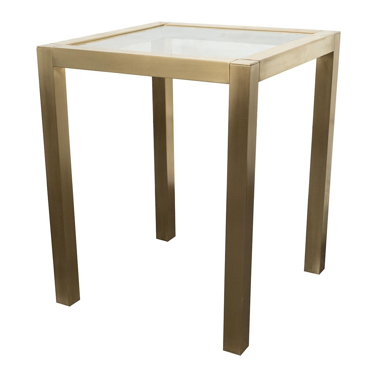 Single satin finish brass side table with inset glass top.