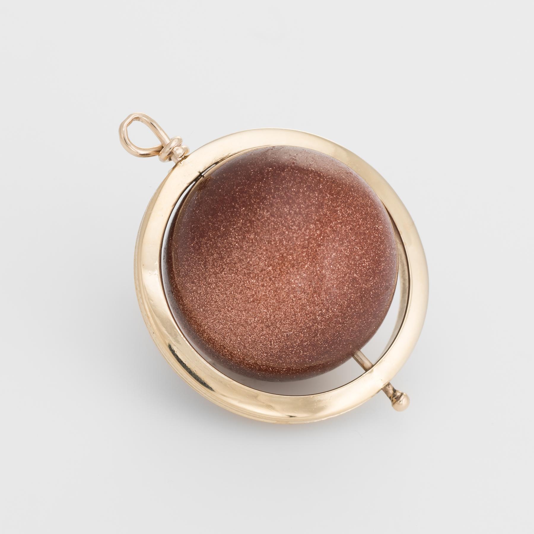 pearl necklace with saturn charm