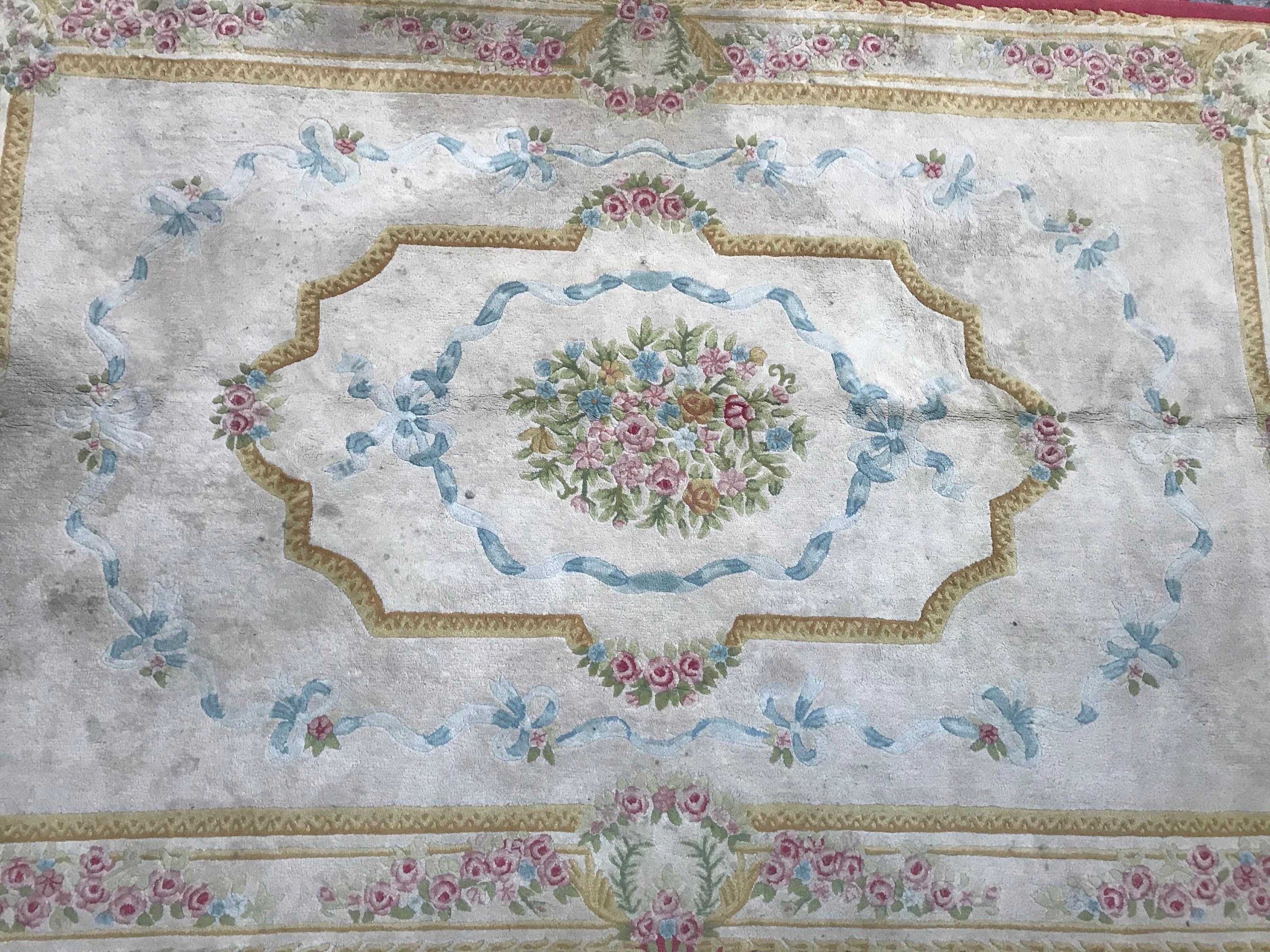 Beautiful late 20th century handcrafted rug with a Savonnerie or Aubusson design and nice colors with blue, pink, purple, yellow and green, entirely handmade with tufted method with velvet on cotton foundation.