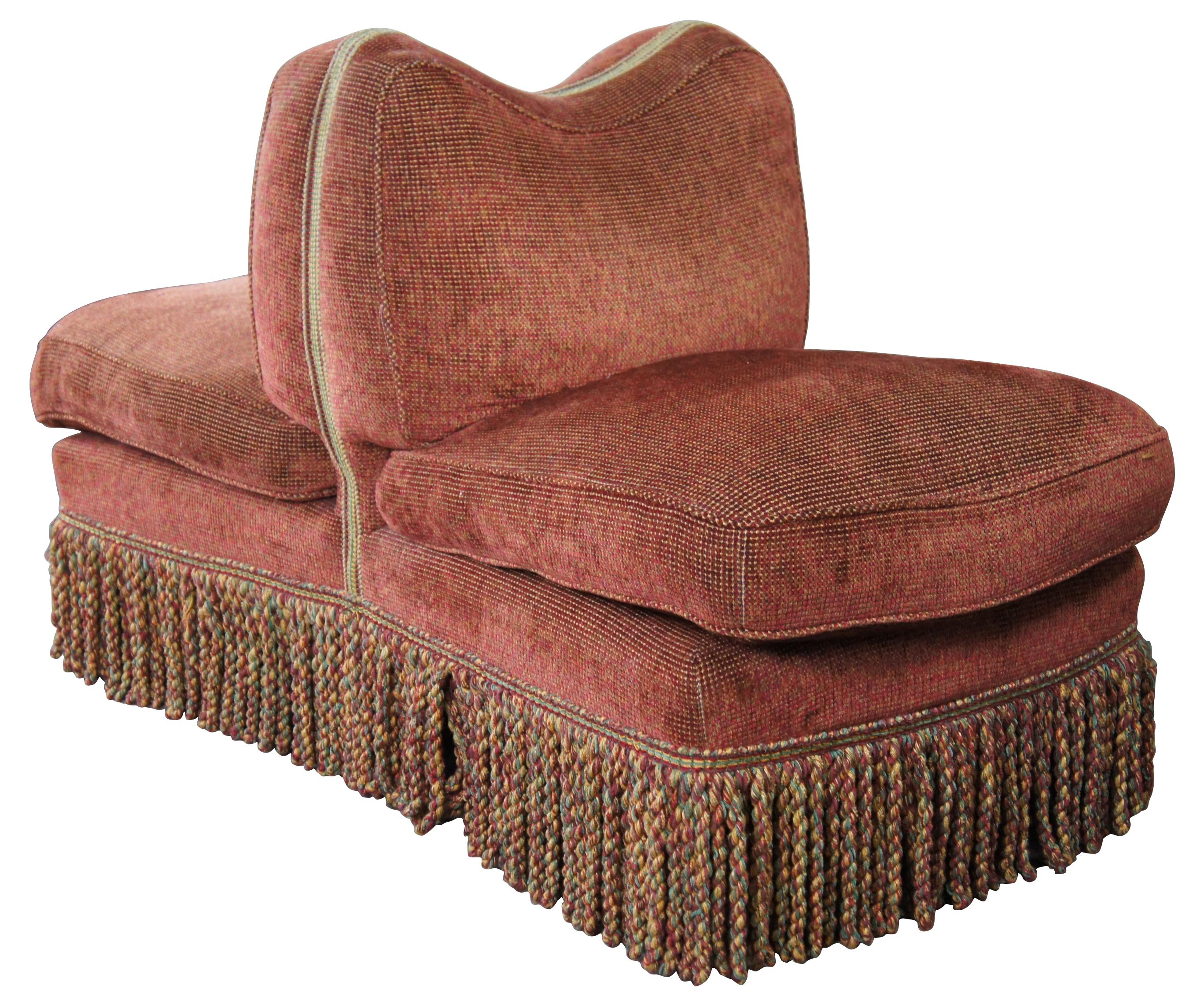 Vintage Scalamandre Tete-a-tete or settee bench chair. A unique duck down filled conversation seat featuring a sloped camelback, ornate twisted rope fringe and six legs with brass castors. Made in Hickory North Carolina, SL-3509. Measures:
