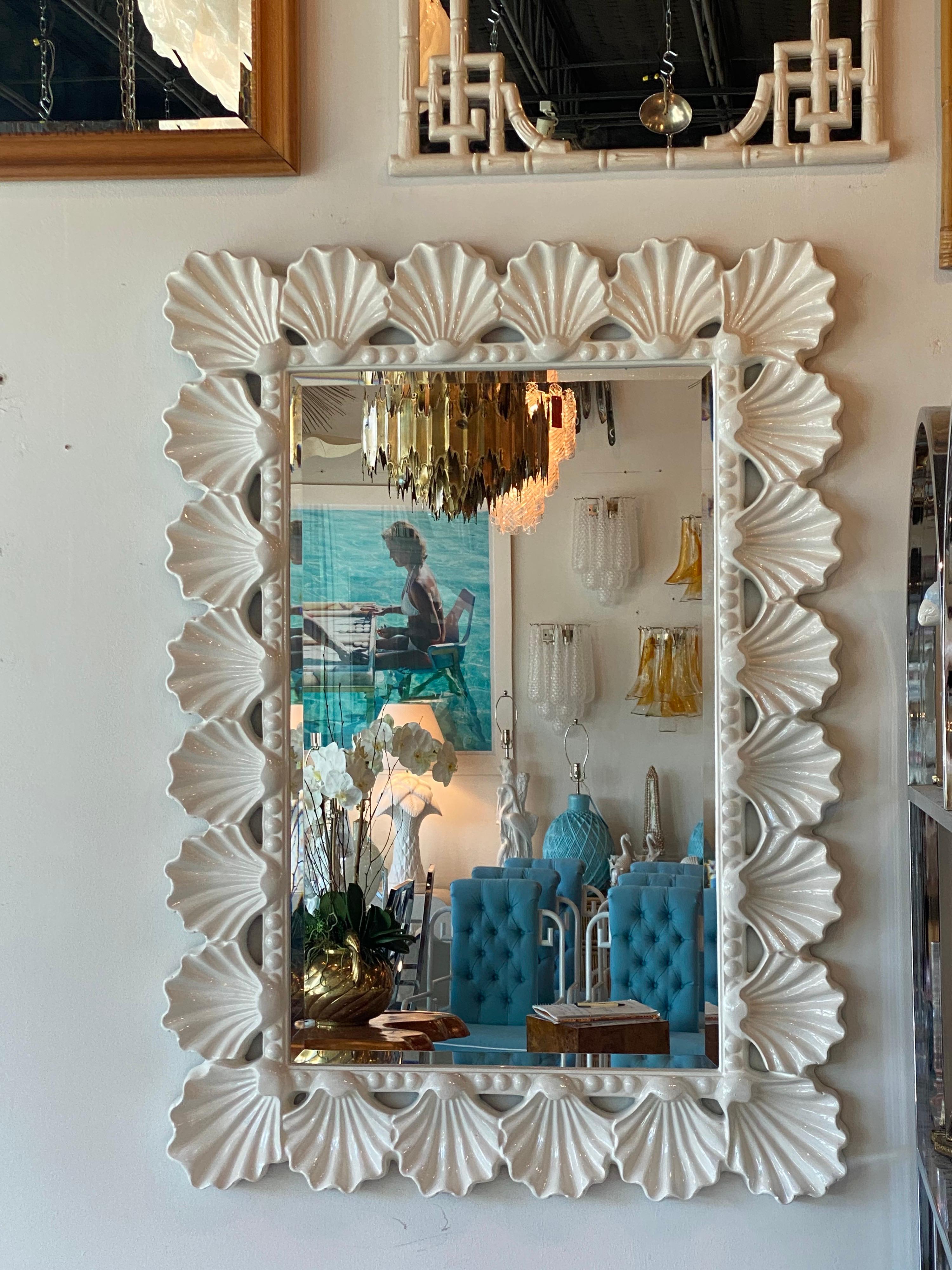 Such a beauty! Vintage scalloped seashell shell wall mirror. Newly lacquered in a soft white gloss. I love the ruffle like edges that the shells have. Comes ready to hang. Made of a composite.