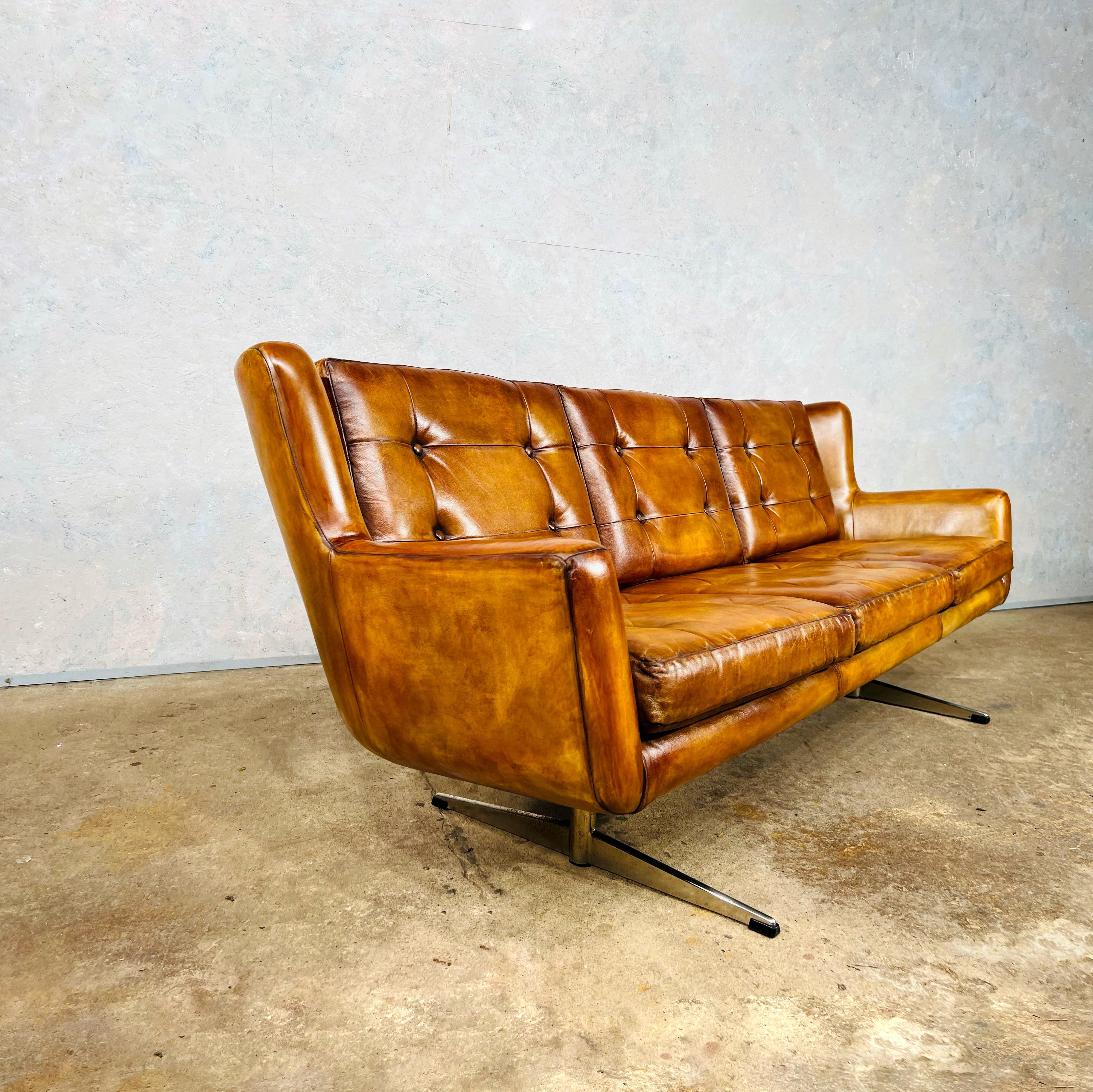 A Very Stylish Vintage Scandinavian 1970s light tan buttoned 3 seater leather sofa with chrome ski legs
Great design with beautiful lines. 

The leather is a stunning hand dyed light tan color and has a great patina and finish.


