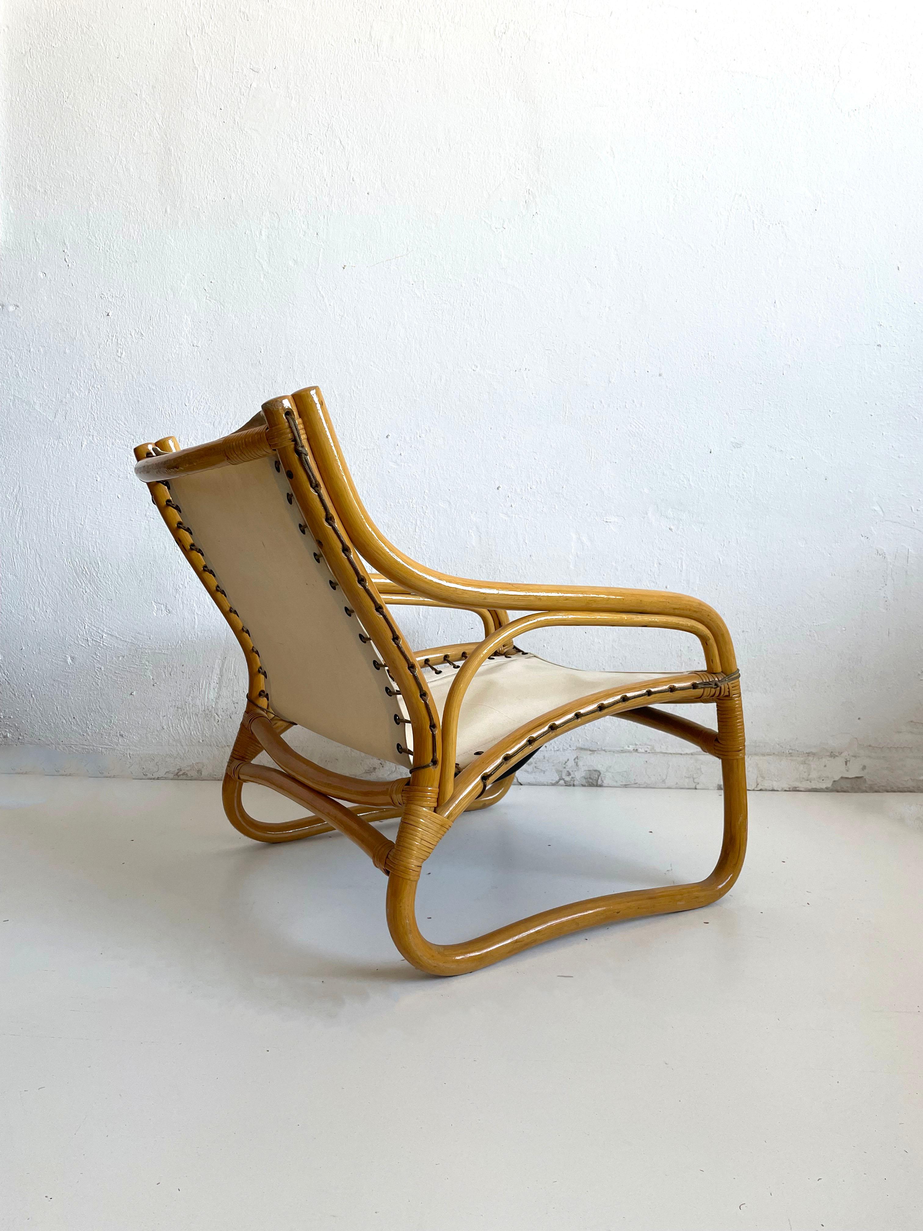 Vintage armchair from the 1970s. 

Produced in Scandinavia by an unknown manufacturer. The quality of the production is very high.

The chair features a bamboo frame with durable fabric strapping and a high-quality light blue (turquoise) colored