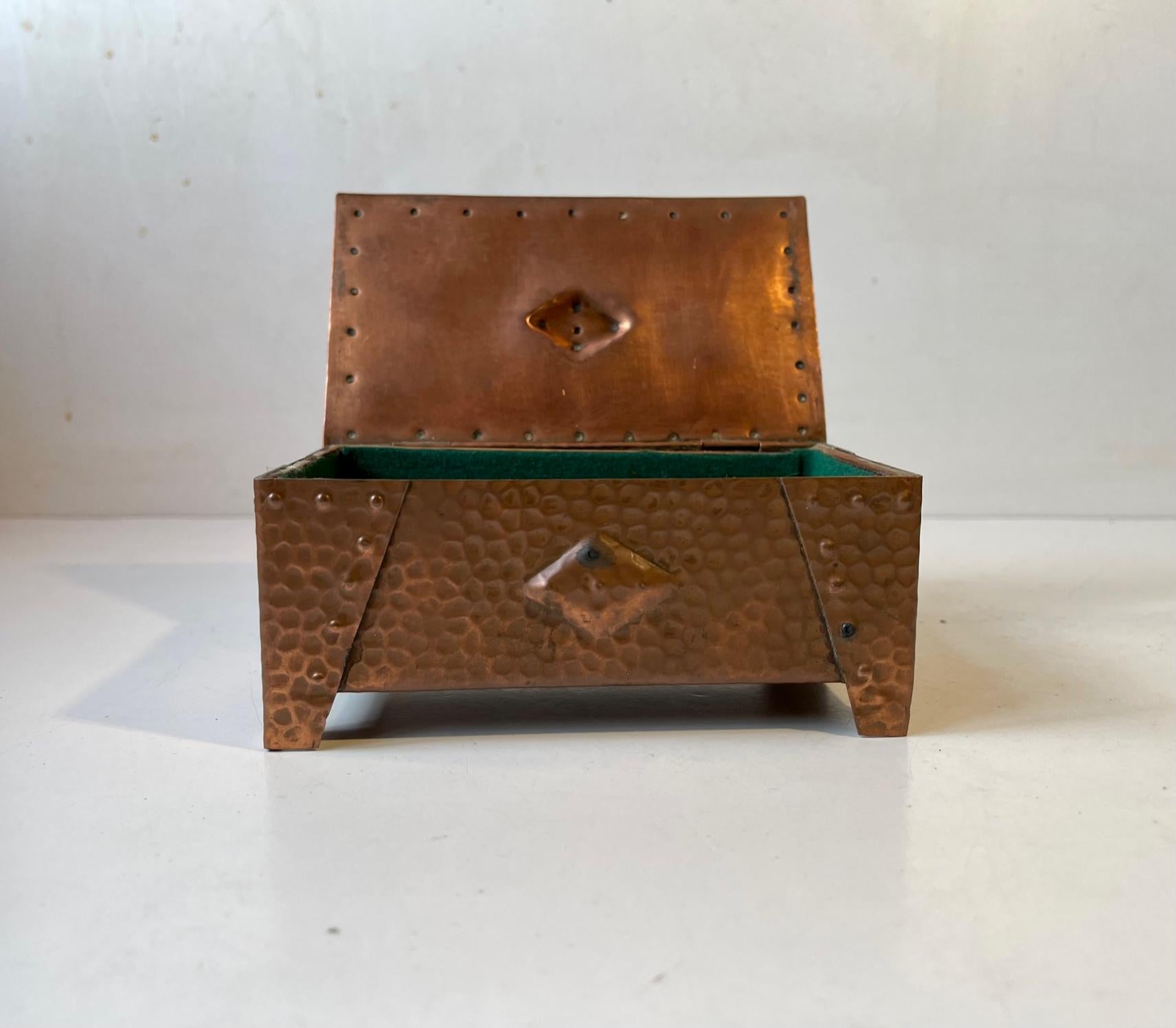 A wellmade and beautifully patinated box in hammered copper. Suitable for Jewelry or small personal items. Distinct brutalist styling with architectural Art Deco element. It was made anonymously in Scandinavia circa 1930-40. Measurements: W: 15 cm,