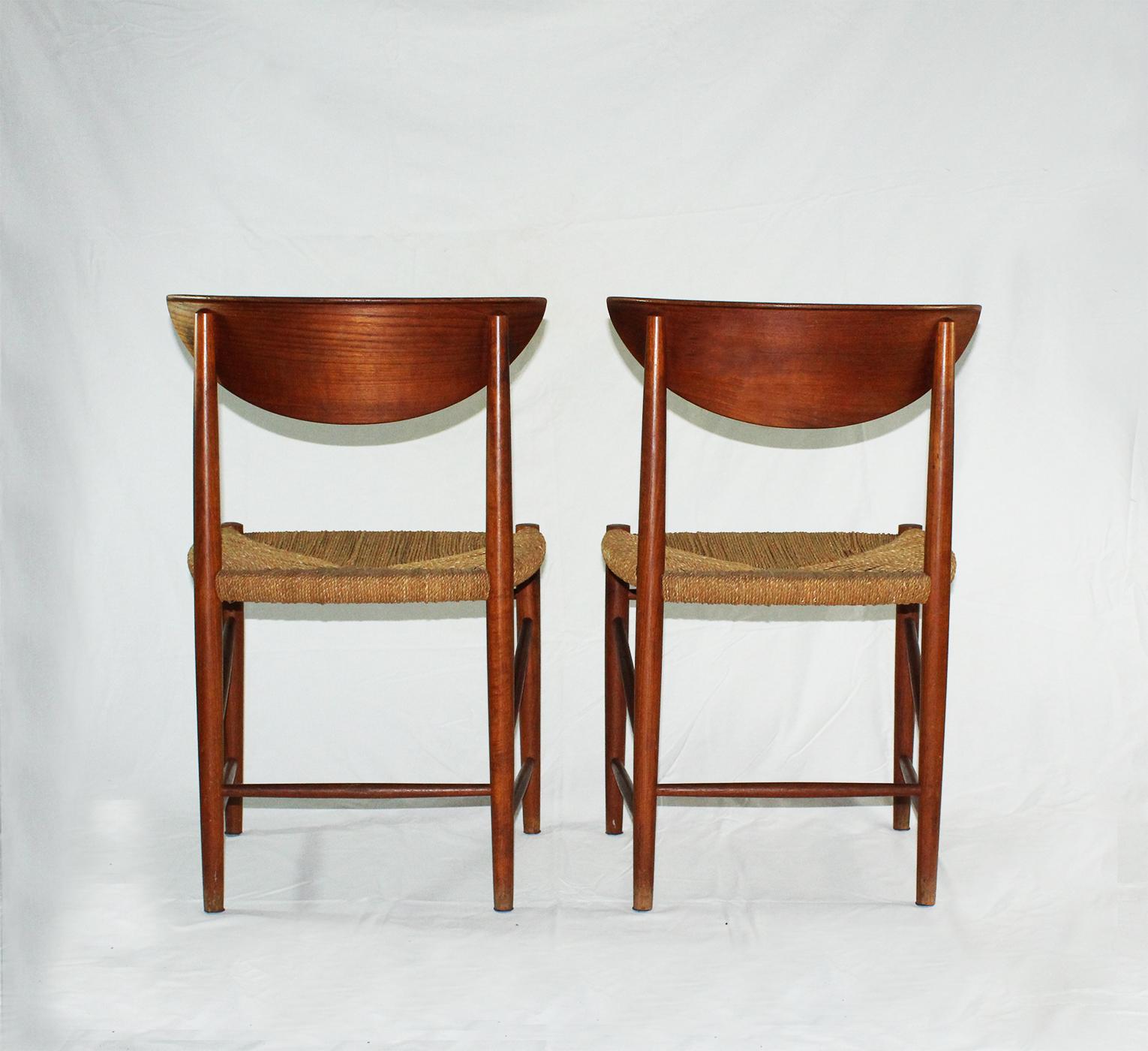 Set of two midcentury Danish dining chairs in teak and papercord designed by Peter Hvidt and Orla Mølgaard Nielsen for Søborg Møbelfabrik, model 316 in the 1950s. Papercord and frame are original. Good vintage Scandinavian chairs.