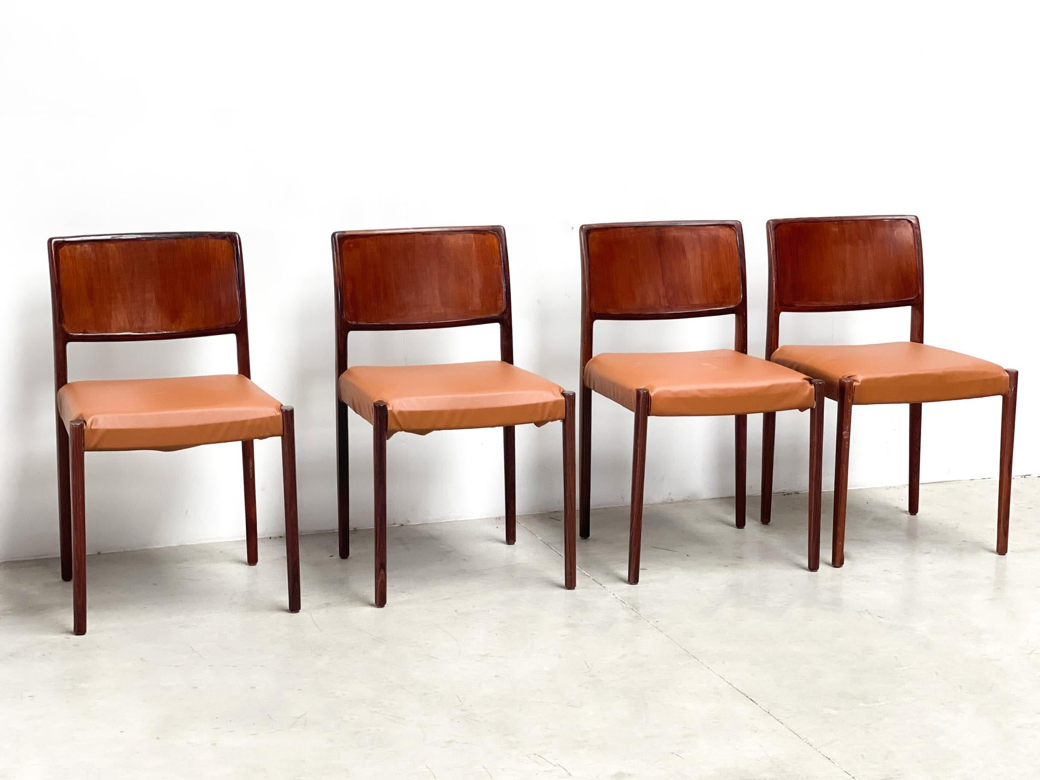 Vintage wooden dining chairs made in Denmark.

Wooden frames with cognac faux leather upholstery

1970s - Denmark

Good overall condition with normal age related wear to the frames.

Dimensions:
Height: 78cm/30.70