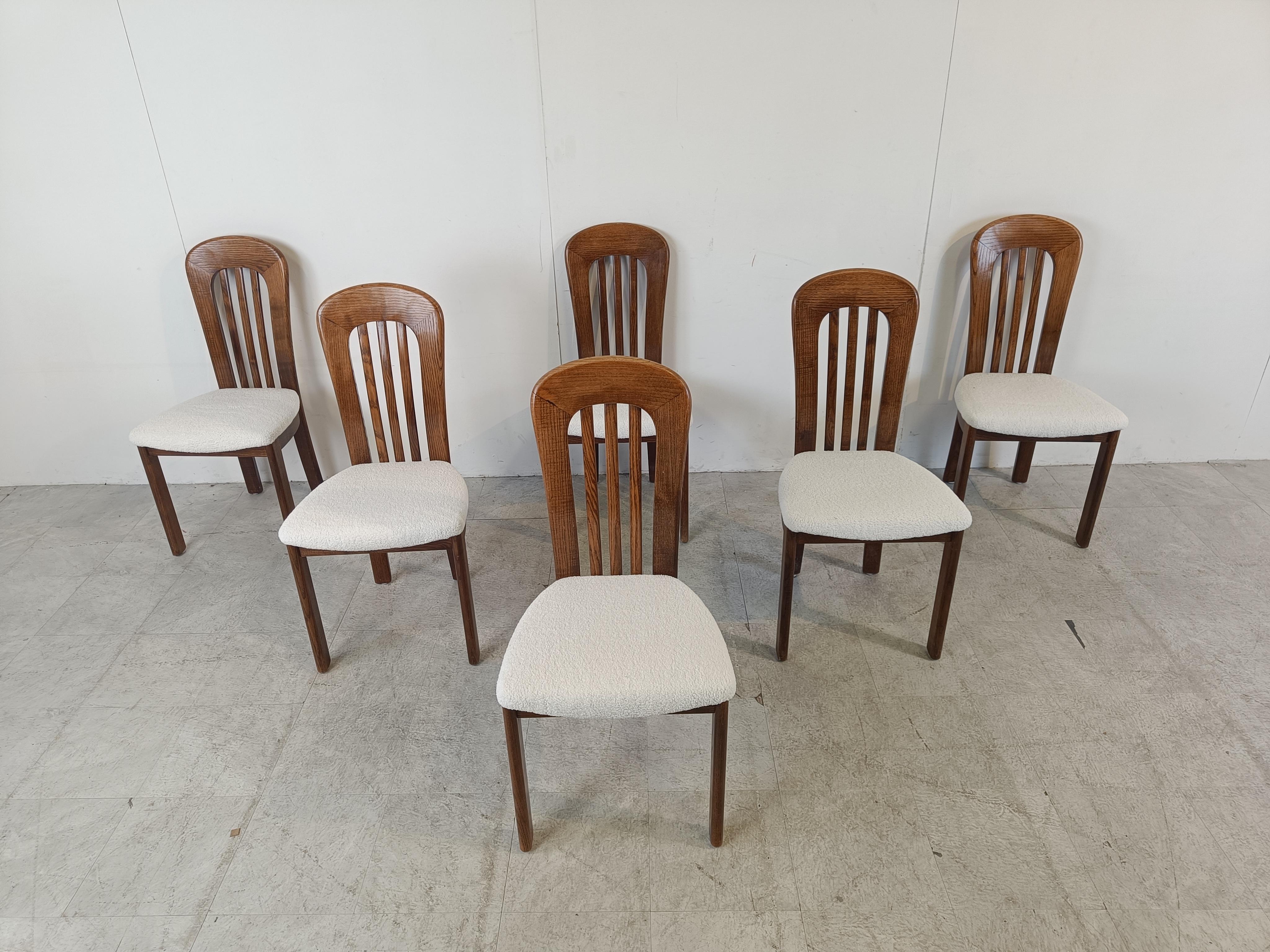 Nicely designed scandinavian dining chairs with wooden frames and newly upholstered seats in bouclé fabric.

Beautiful, timeless design which is very sturdy as well.

Good condition.

1960s - Denmark

Dimensions:
Height: 95cm/37.40
