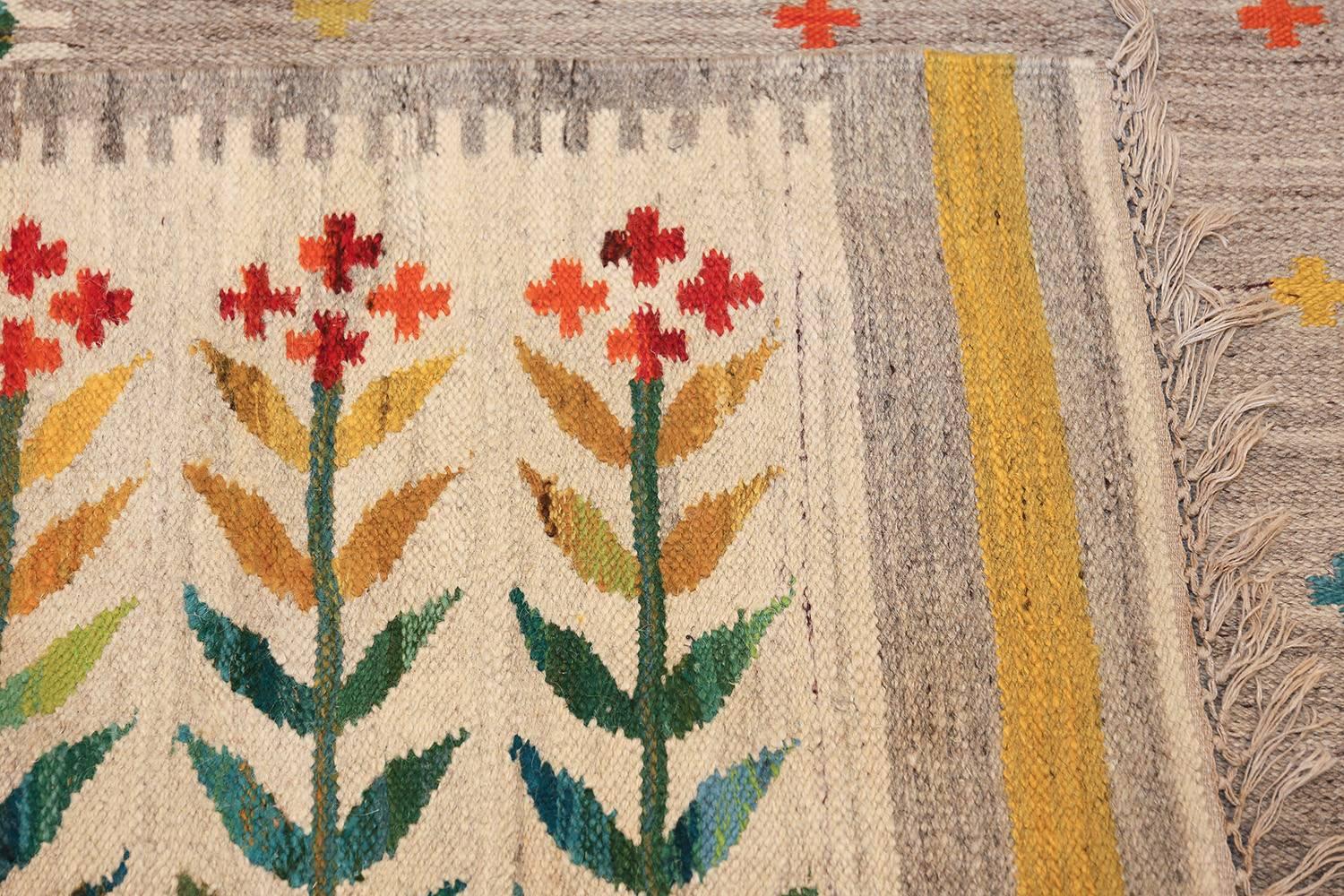 Beautiful and extremely artistic vintage scandinavian flat woven swedish kilim rug , country of origin/rug type: Scandinavia rug, circa date: mid–20th century. Size: 6 ft 8 in x 9 ft 9 in (2.03 m x 2.97 m) 

A garden of happy colors awaits you with
