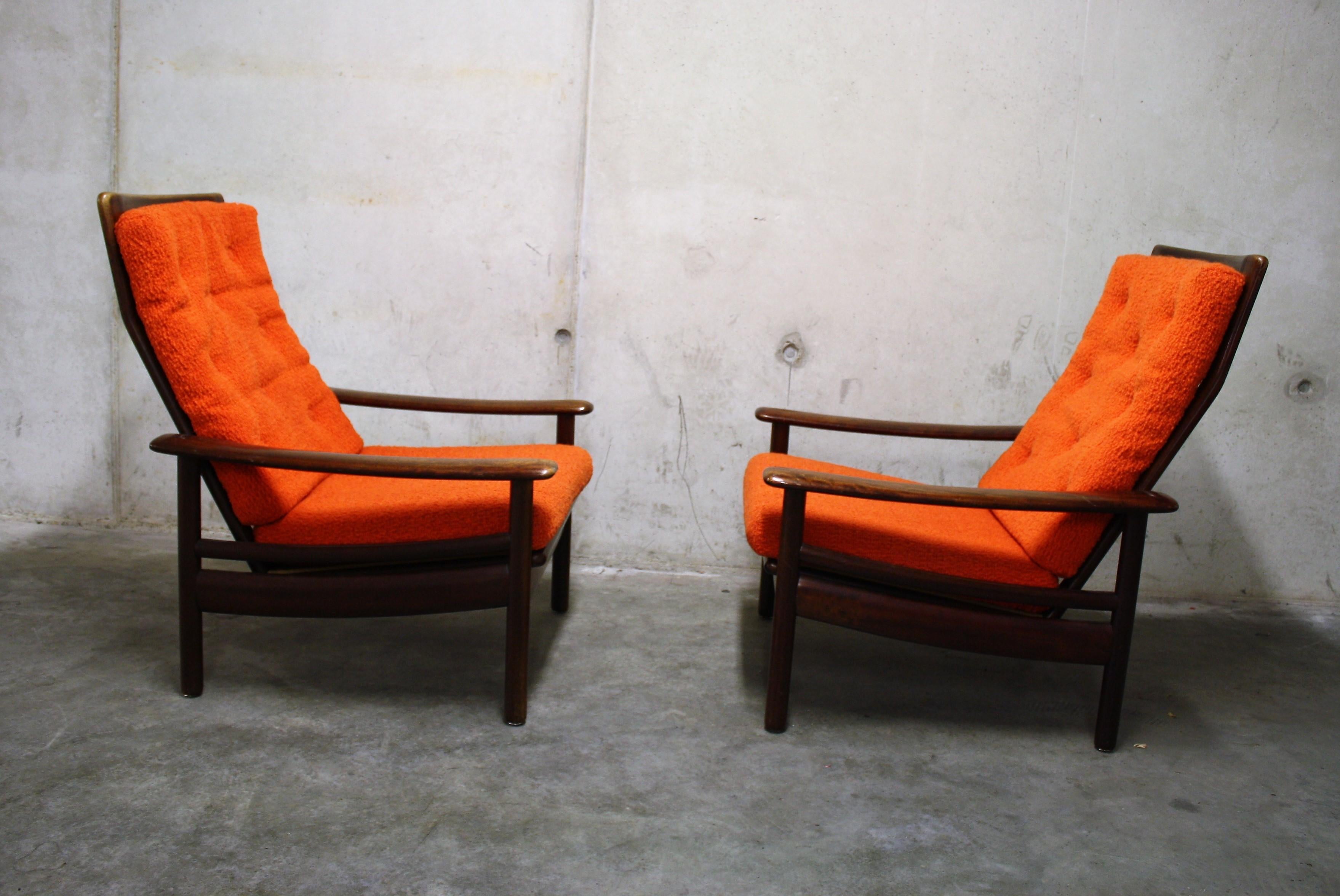 Pair of vintage teak wooden Scandinavian lounge chairs.

They feature orange fabric cushions, but we can provide a modern day color for the cushions as well.

They have a beautiful elegant Scandinavian design which make them so charming.

Good