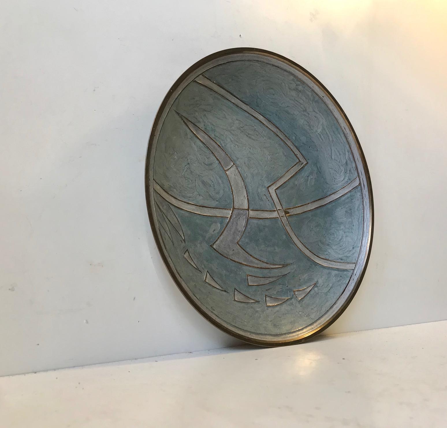 Patinated brass charger dish with abstract - Brutalist motif executed in hand applied enamel. Anonymous Scandinavian maker, circa 1950.