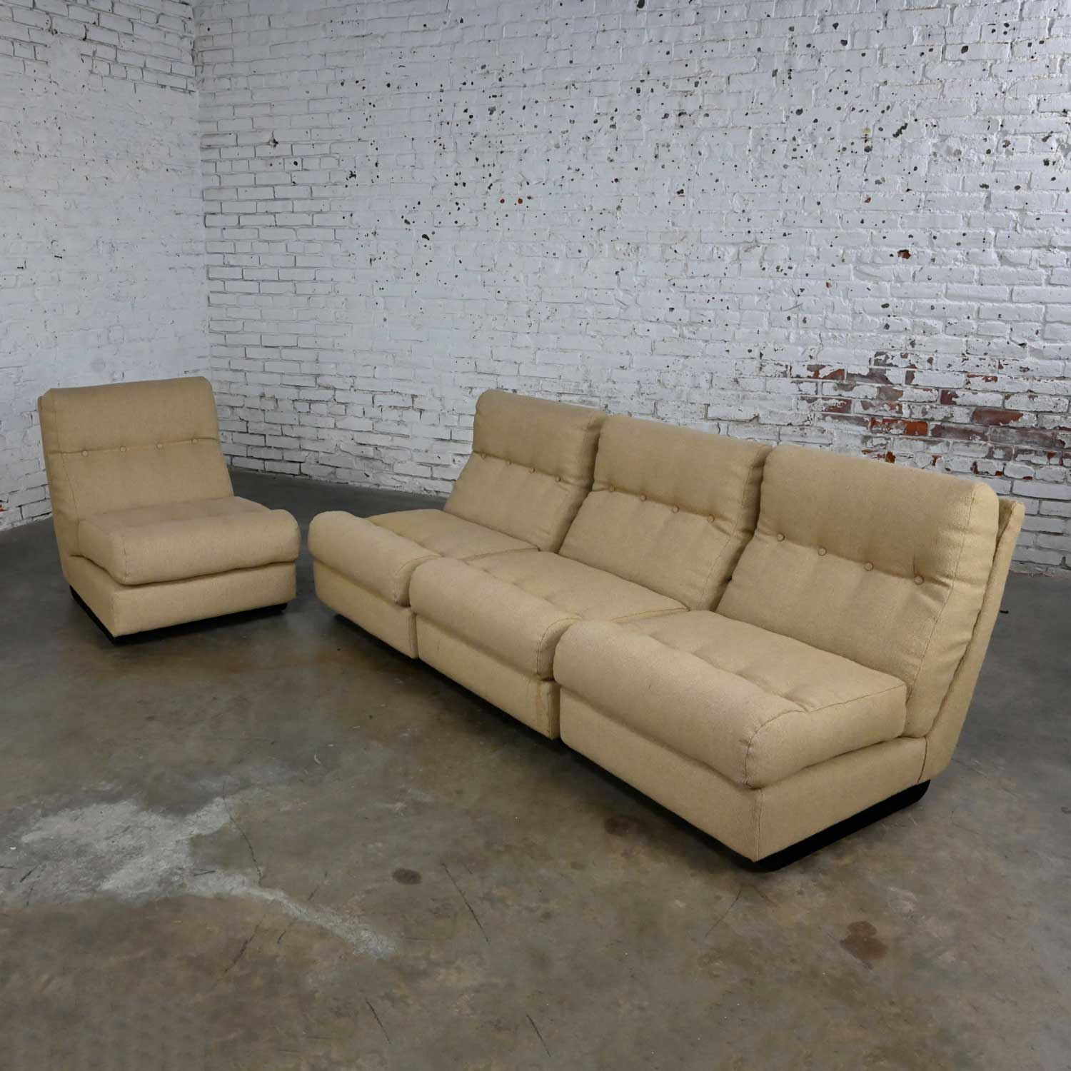 Awesome vintage Scandinavian Modern khaki hopsacking fabric 4-piece modular sofa made in Sweden. Beautiful condition, keeping in mind that this is vintage and not new so will have signs of use and wear. The bases have a fresh coat of black paint. It