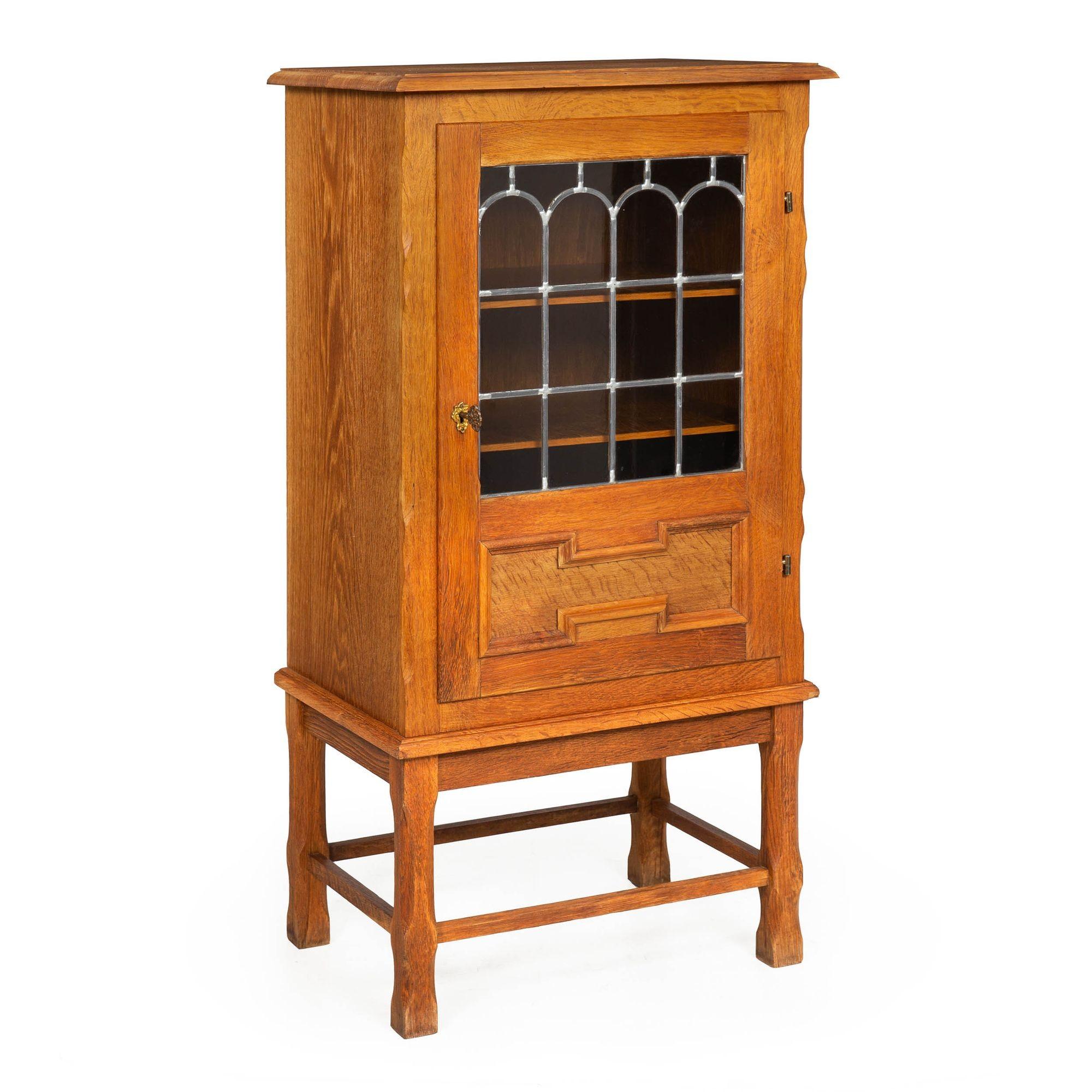 SCANDINAVIAN MODERN PATINATED OAK DISPLAY CABINET
Probably Danish, circa 1950s  unmarked
Item # 211RIP29L 

A striking Scandinavian Modern cabinet executed in patinated and oiled oak and oak veneers, it features a single glazed door with arched