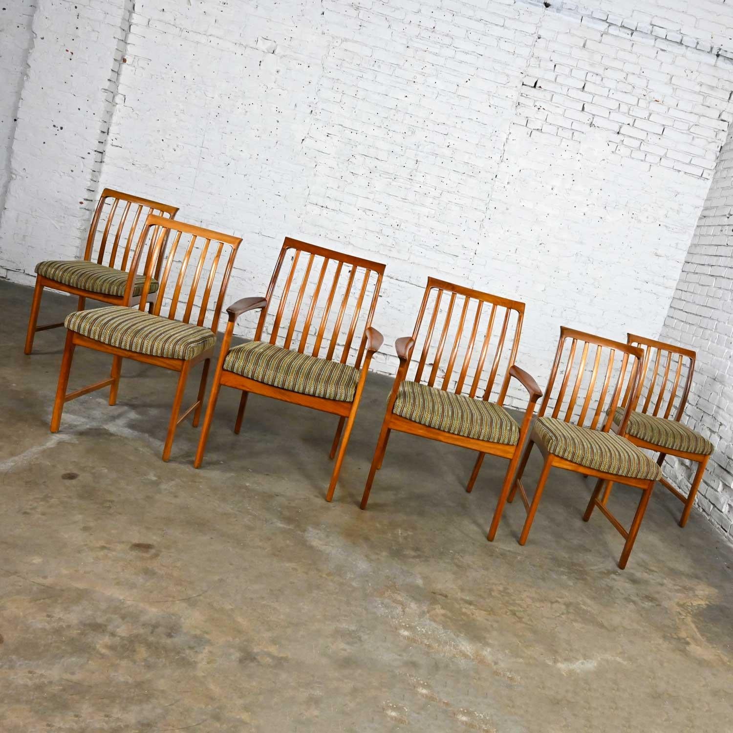 Stunning vintage Scandinavian modern dining chairs by Folke Ohlsson for DUX, four side and two armchairs, set of 6. Also includes 2 loose back cushions for armed chairs. Beautiful condition, keeping in mind that these are vintage and not new so will