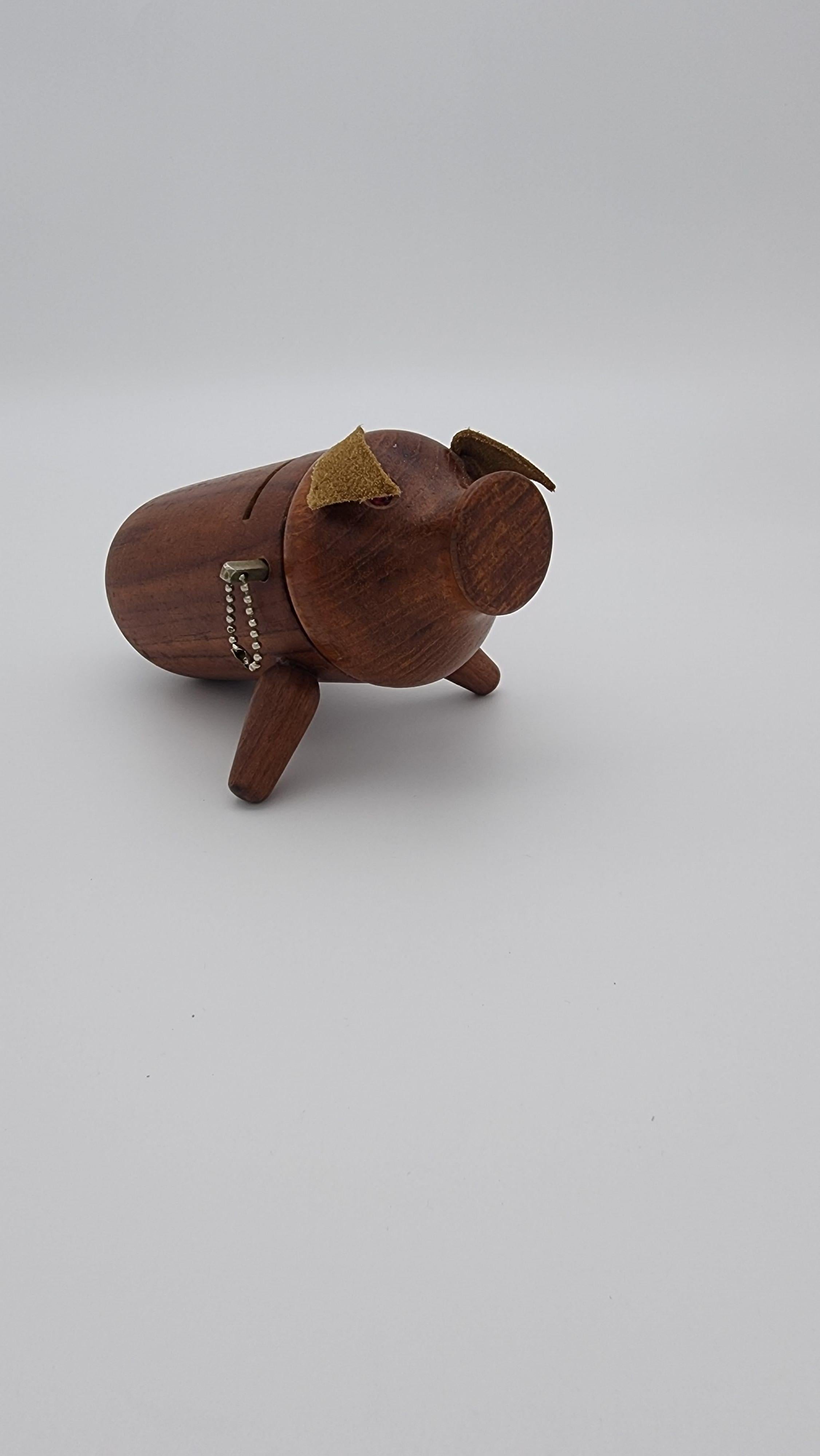 Vintage Scandinavian Modern Teak Piggy Bank.  brass peg removed, and head come out to take out the coins. Marked Denmark on the underside.