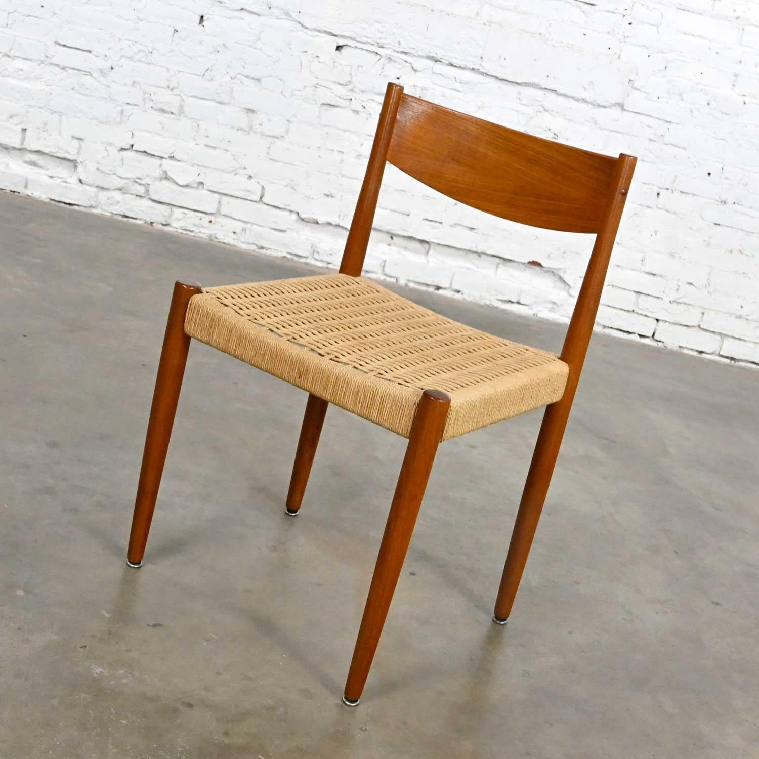 Lovely vintage Scandinavian Modern teak and paper cord woven seat side or dining chair attributed to designer Poul Volther for Frem Rojle. Beautiful condition, keeping in mind that this is vintage and not new so will have signs of use and wear.