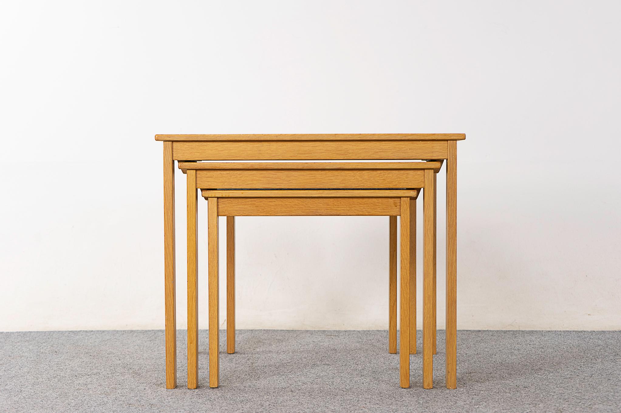 Oak Scandinavian nesting tables , circa 1960's. Well constructed trio with lovely lines. Space saving design, the footprint of one table with the functionality of three! 