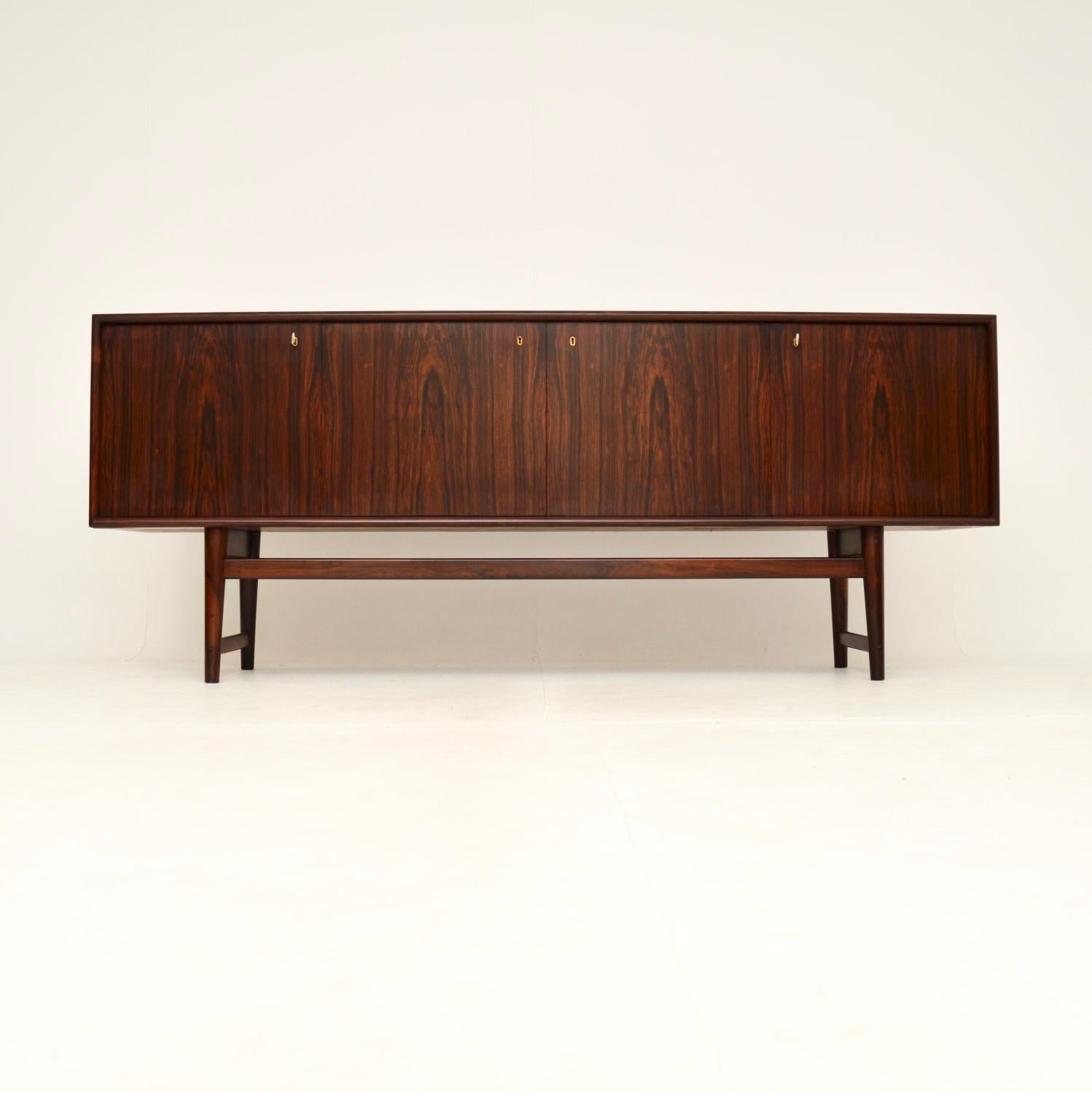 An absolutely stunning vintage Scandinavian sideboard of the highest order. This was made in Norway, it dates from the 1960’s.

The quality is outstanding, this is extremely well made with wonderful grain patterns and a gorgeous colour tone. The