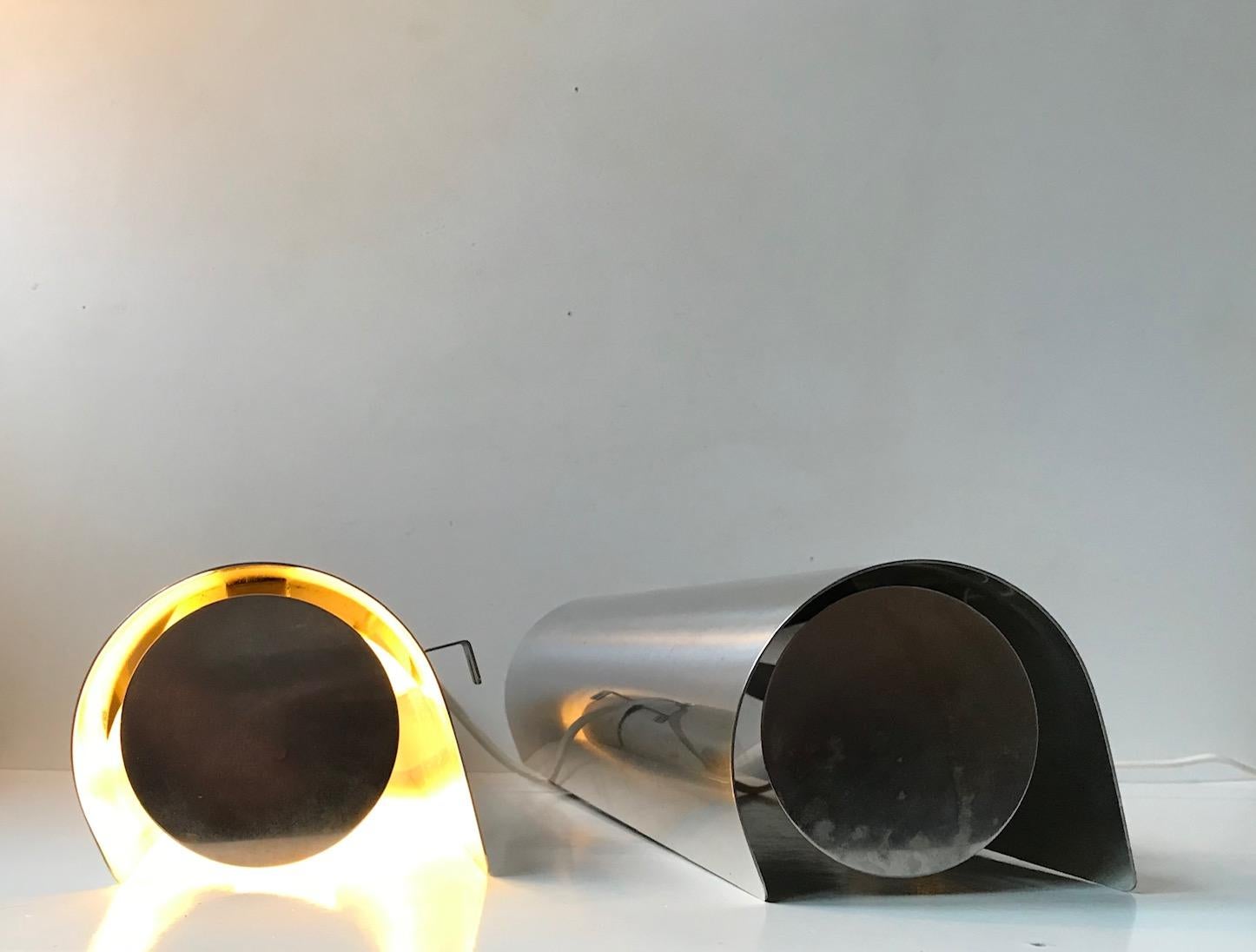A rare pair of polished stainless steel wall lights. Cylindrical - tubular in shape and measuring 40 cm in width/length. Designed and manufactured by K. S. Design in Denmark during the late 1970s. The style of Nordic Lighting Minimalism is very