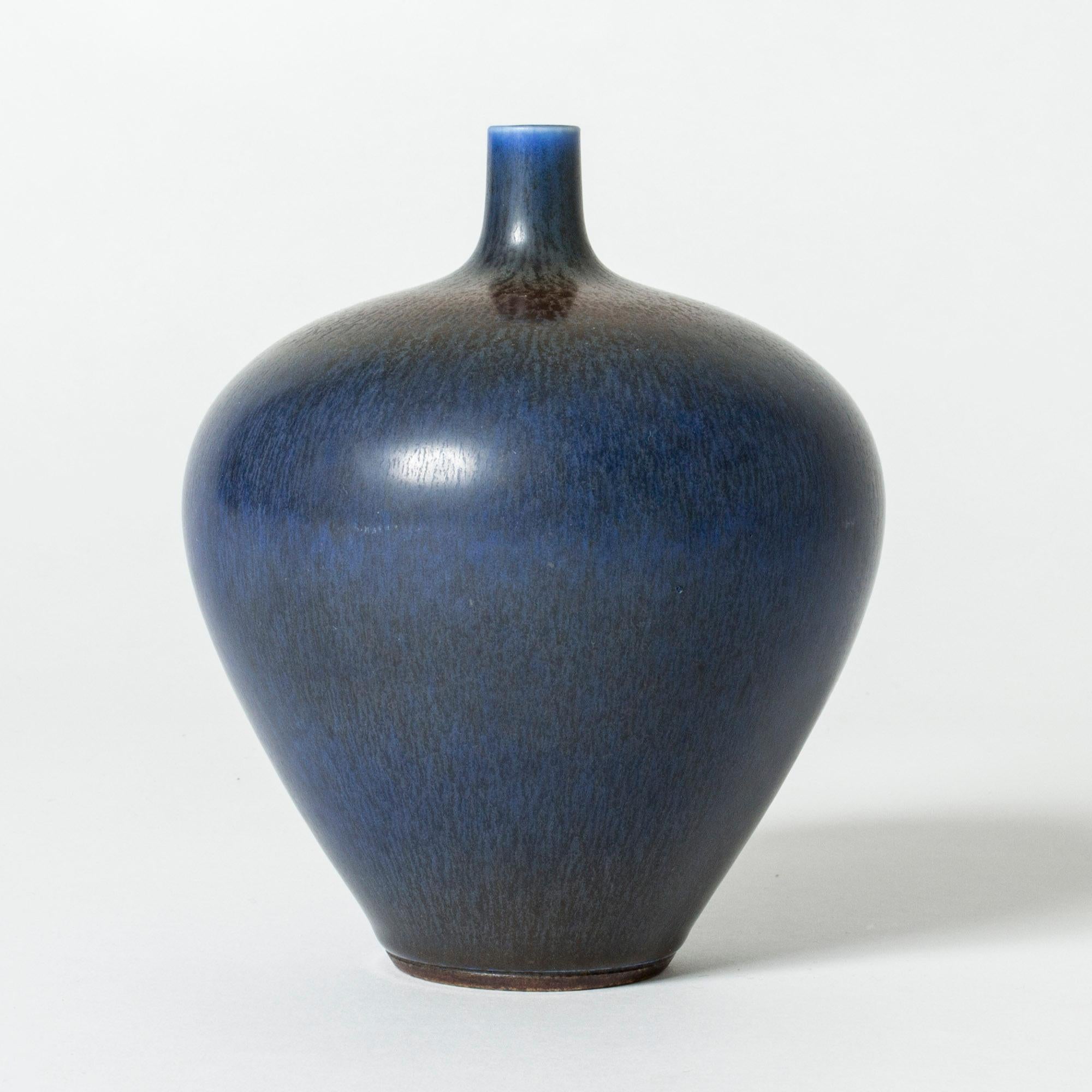 Beautiful stoneware vase by Berndt Friberg, in an elegant apple form. Hare’s fur glaze in nuances of blue.

Berndt Friberg was a Swedish ceramicist, renowned for his stoneware vases and vessels for Gustavsberg. His pure, composed designs with