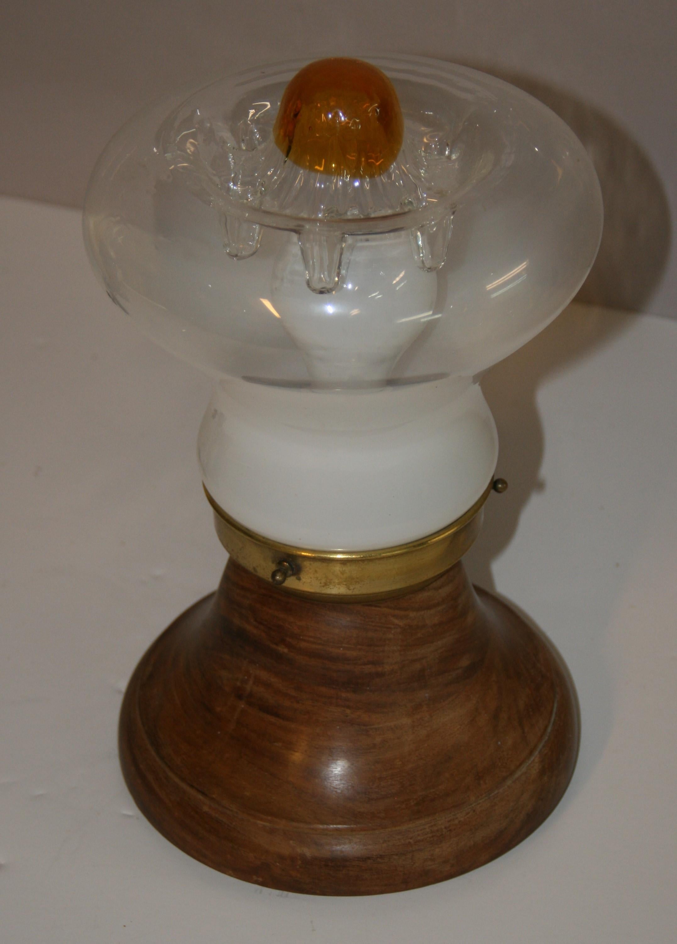 1688 Vintage Scandinavian taple lamp with Mazzega glass set on a solid  Teak base
Inline on /off switch
Rewired takes one 60 watt Edison base bulb