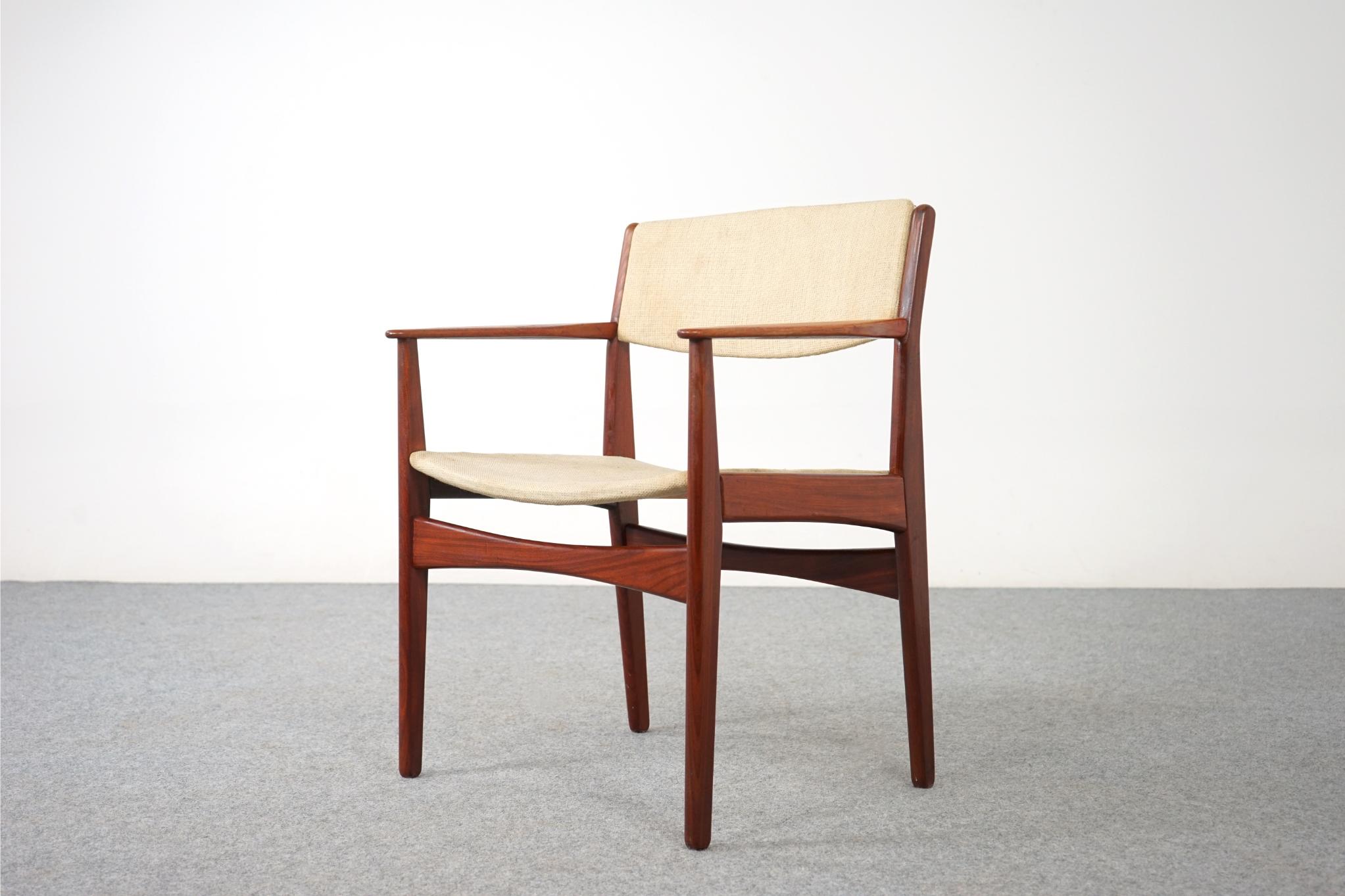 Teak Scandinavian arm chair, circa 1960's. Solid wood frame with upright upholstered back provides support and comfort. Clean modern design makes it easy to combine with other furniture in your home. A versatile chair for all your seating