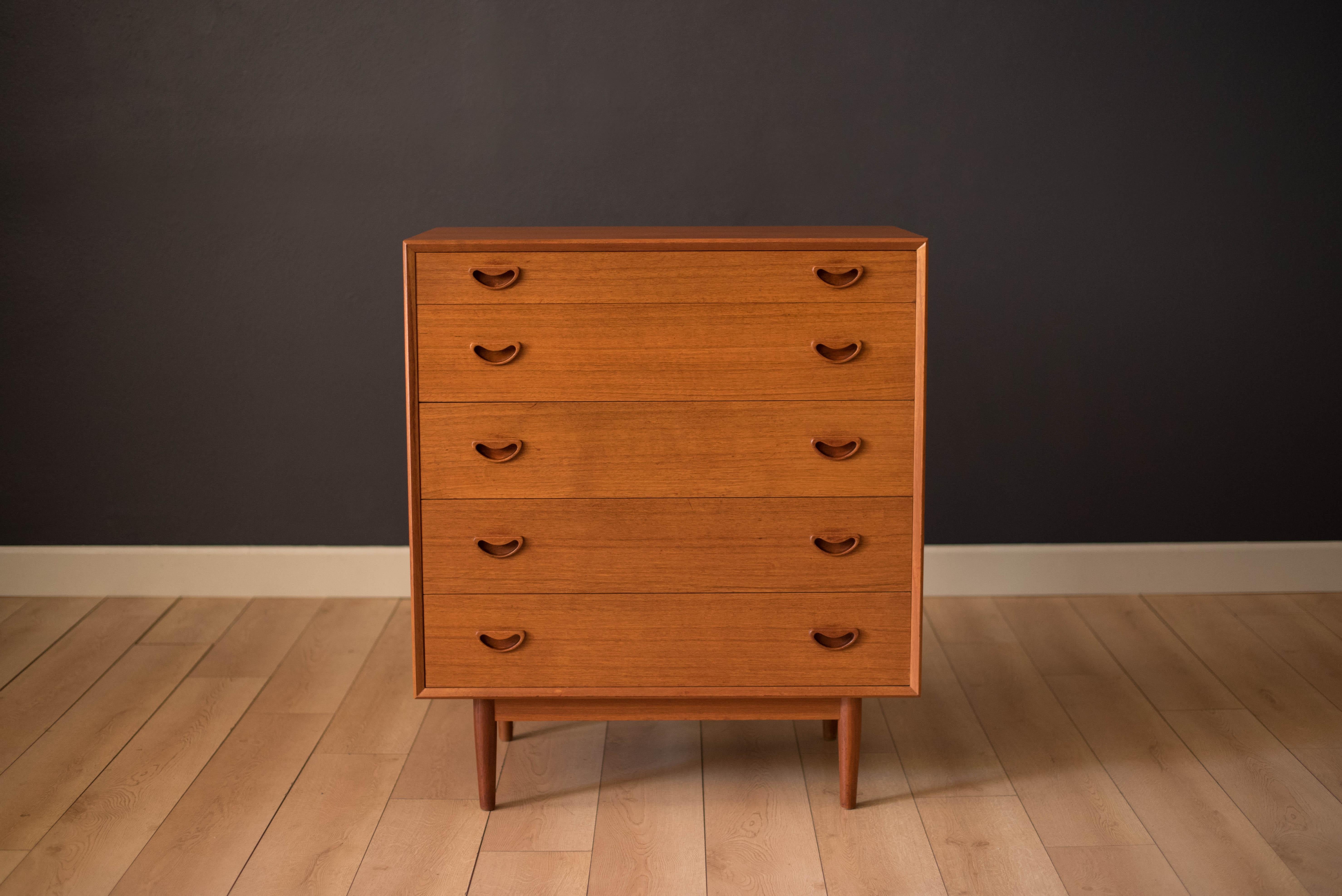 Mid-Century Modern tall dresser in teak, circa 1960s. This piece offers plenty of storage and includes five dovetailed drawers with sculpted handles. Features a beveled edge frame and Classic dowel legs. Displays a finished backside.


Offered by