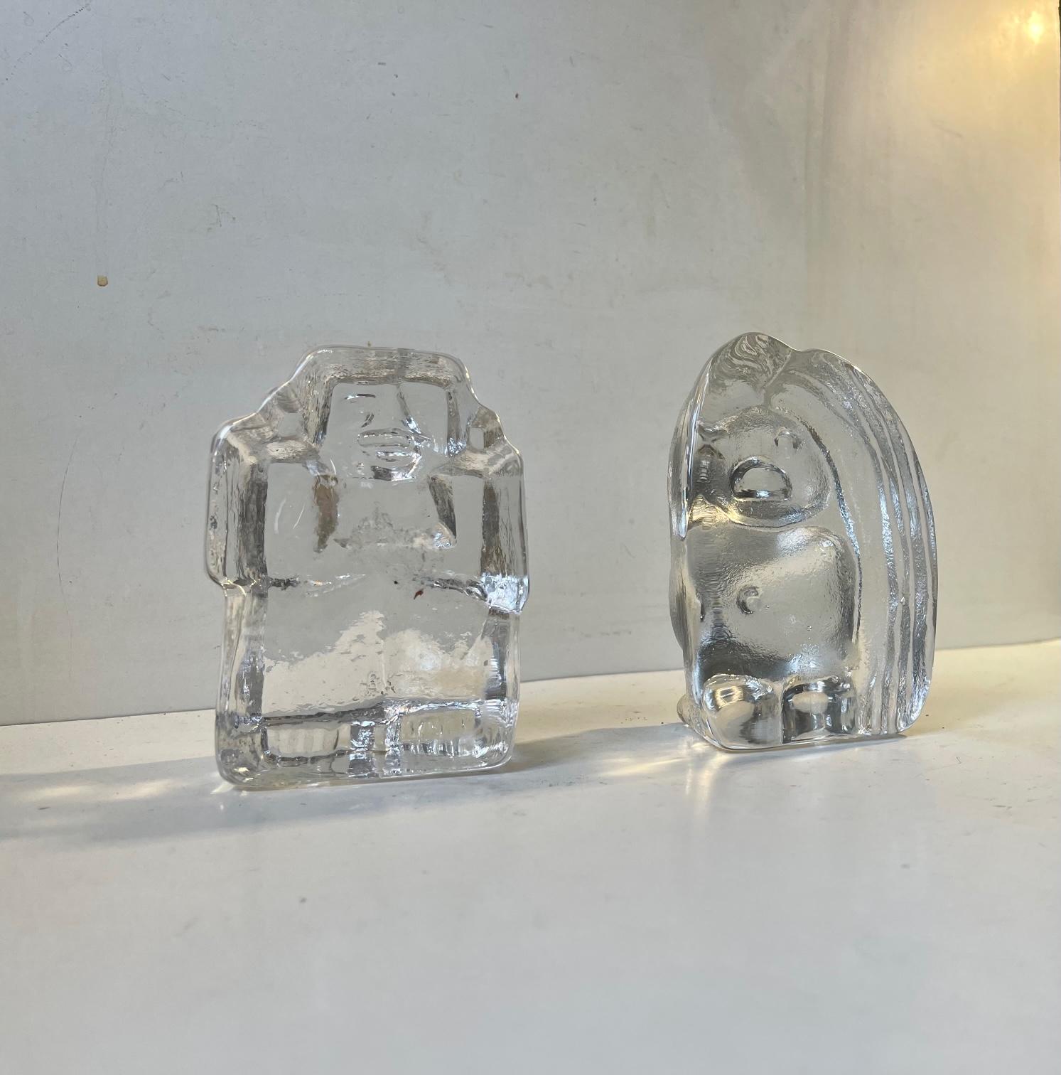 A cute couple of heavy ice glass figurines or bookends (Flat backs) The female Troll with long hair was designed by Peter Johansen and manufactured by Bergdala Glasbruk in Sweden during the late 1960s or early 1970s. The monkey or man was designed
