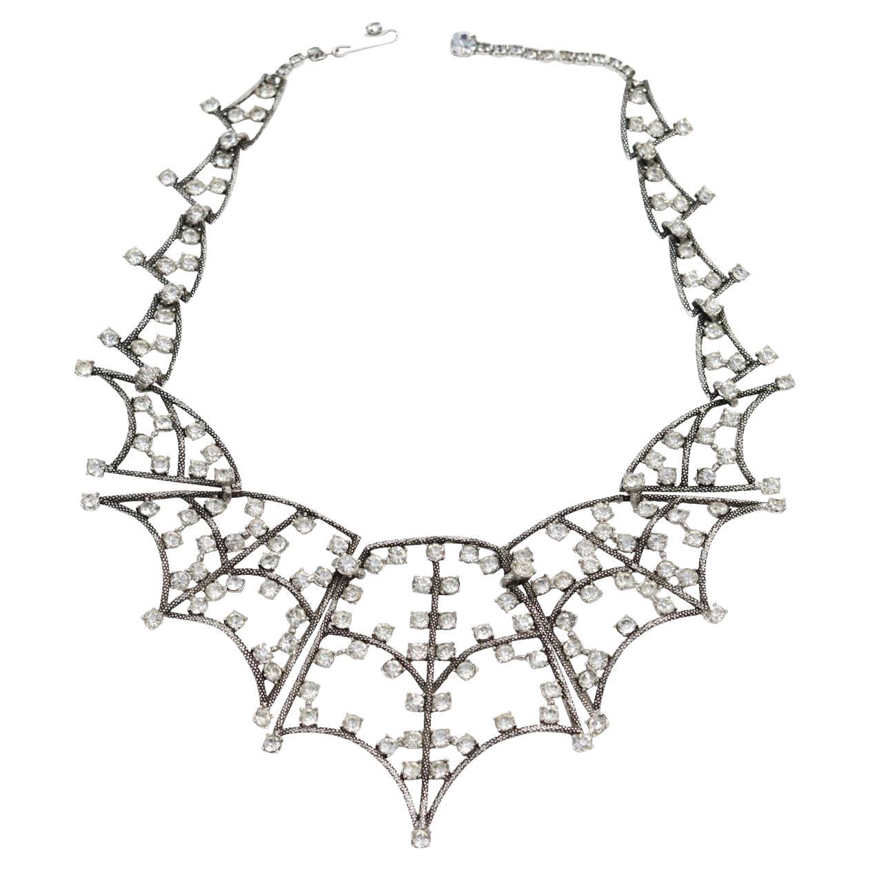 Collectible Schiaparelli Silver Tone Diamante Spider Necklace Circa 2013s. This spectacular Schiaparelli choker necklace is in a spider web design and is so special and so different. The pieces are graduated in size so the biggest piece is in the