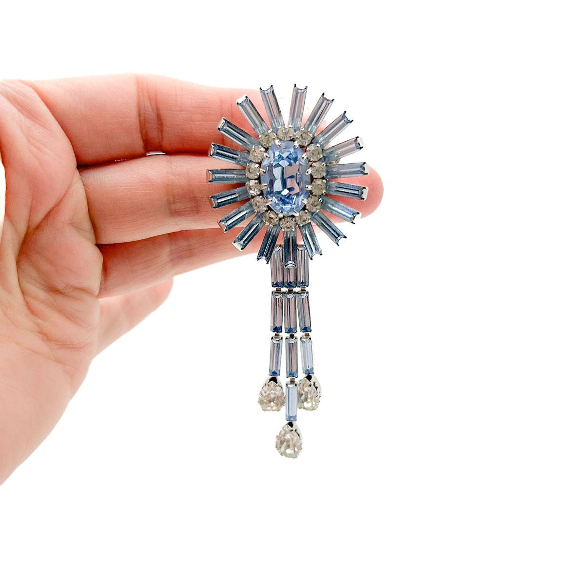A timeless Vintage Schöffel Crystal Brooch. An ultra rare find and a seriously divine colour. Cornflour blue crystals in fancy cut including baguettes, ovals, teardrops and chatons are set in a design that is forever a classic and totally