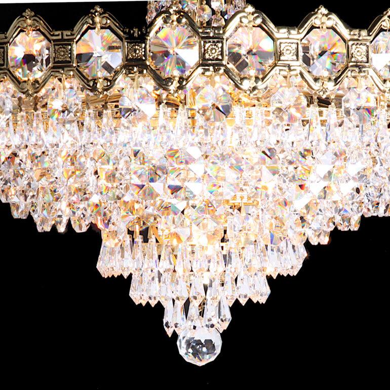 A vintage Schonbek two-tier Empire style crystal chandelier.