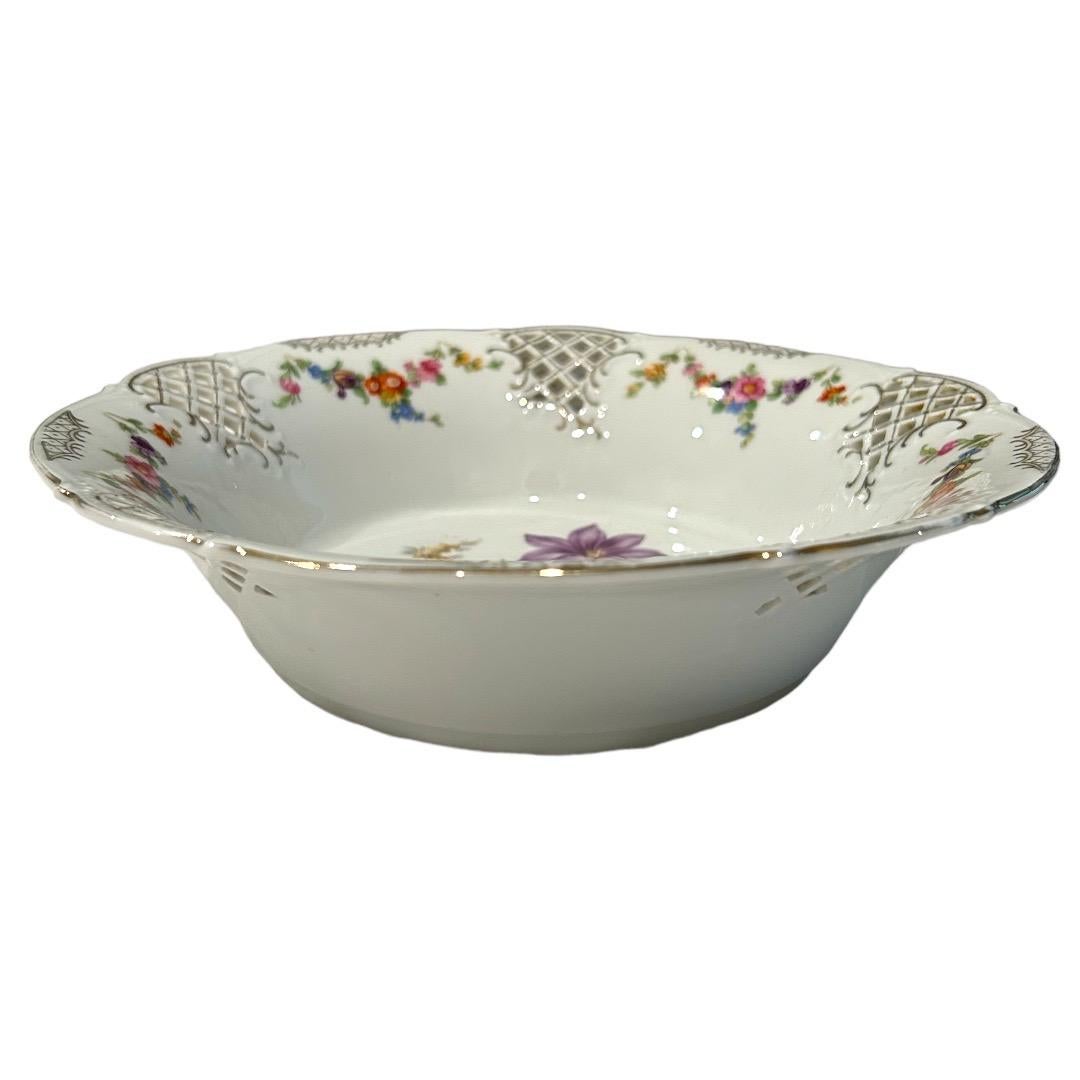 Excellent condition~no chips or cracks! Decorated multicolor floral pattern on a white porcelain bowl; scalloped edge with gold filigree and pierced sides for added design; a great addition to any table decor!

9.25”dia x 2.25”h.