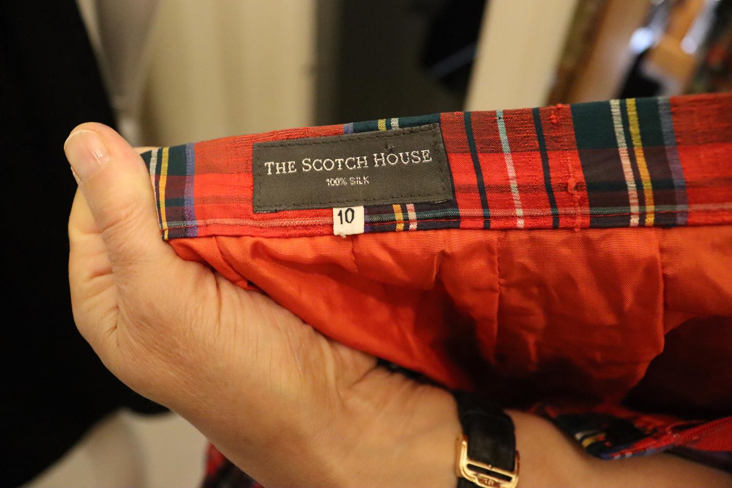 A wonderful vintage silk skirt by The Scotch House. 
The skirt has a red background with multicolour check detail. - red, blue and yellow. The skirt is lined with a full net petticoat, a  great party skirt. 
100 % silk Measurements Waist 27'',