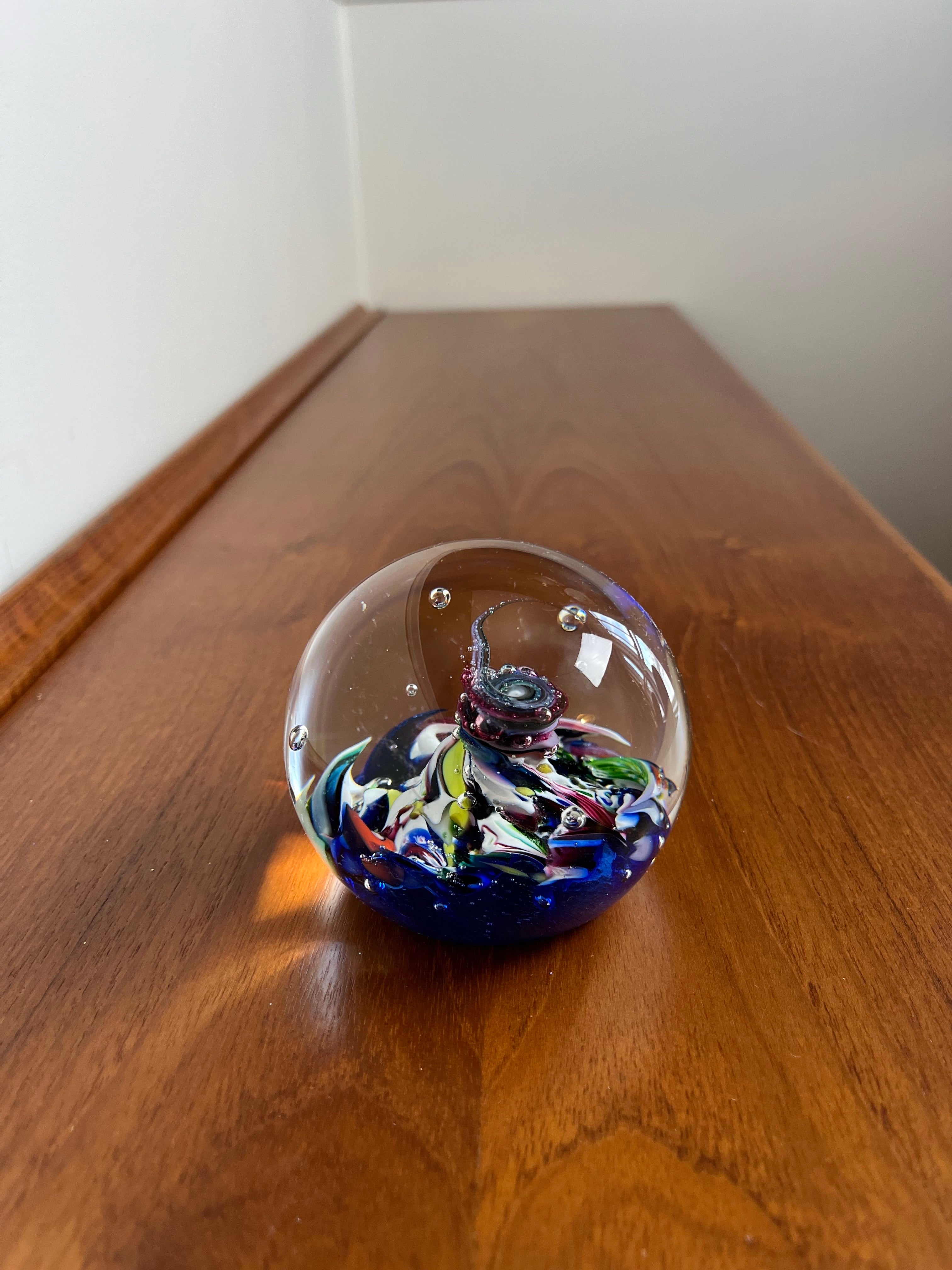 Classic Scottish blown glass paperweight. interesting visual with twisted design. Great colors.
Caithness Myriad
Scotland