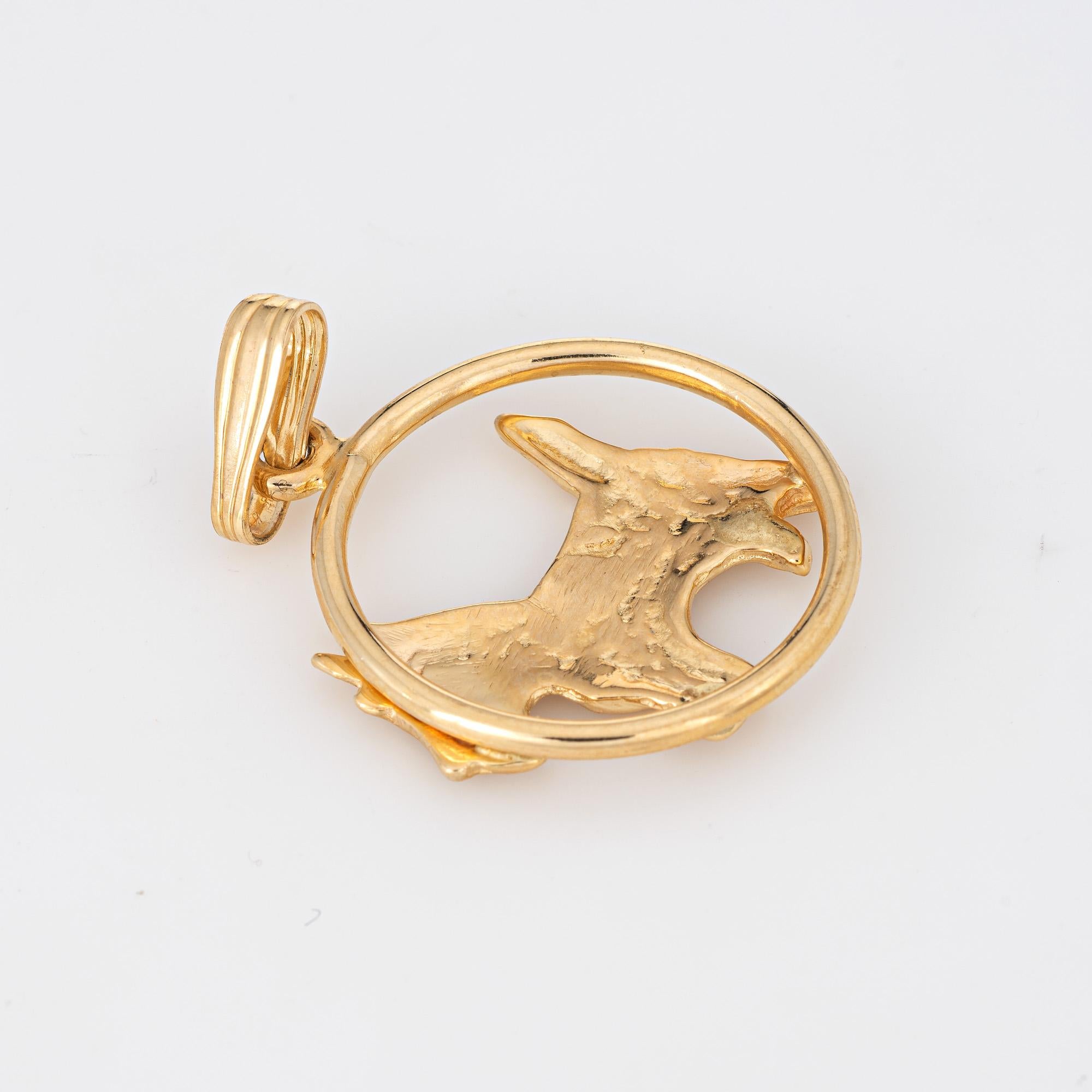 Finely detailed vintage Scottish Terrier dog charm crafted in 14k yellow gold.  

The sweet charm features a charming scottie terrier set within a circular mount. The piece can be worn as a charm on a bracelet or as a pendant.

The charm is in very