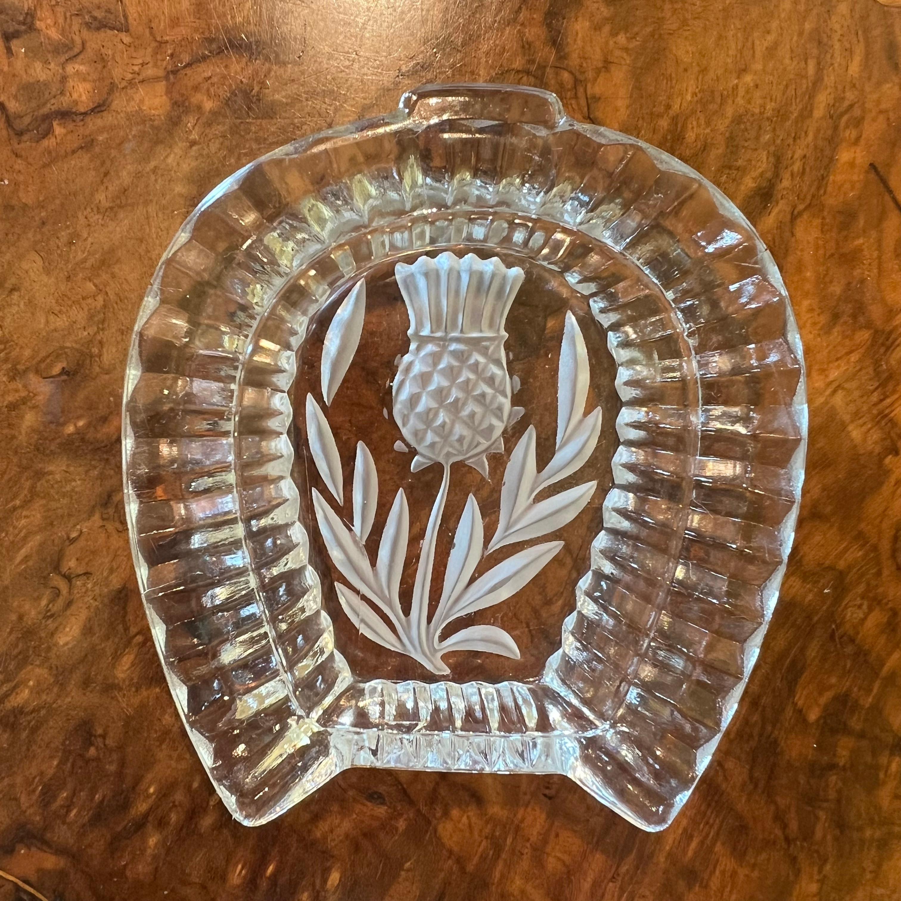 Description: Horse show shapes dish with embossed centre thistle design, some scratches to back

Material: Glass  

Measurements: 1.5cm high, 9.5cm length, 10cm width 

Postage via Australia Post with tracking available