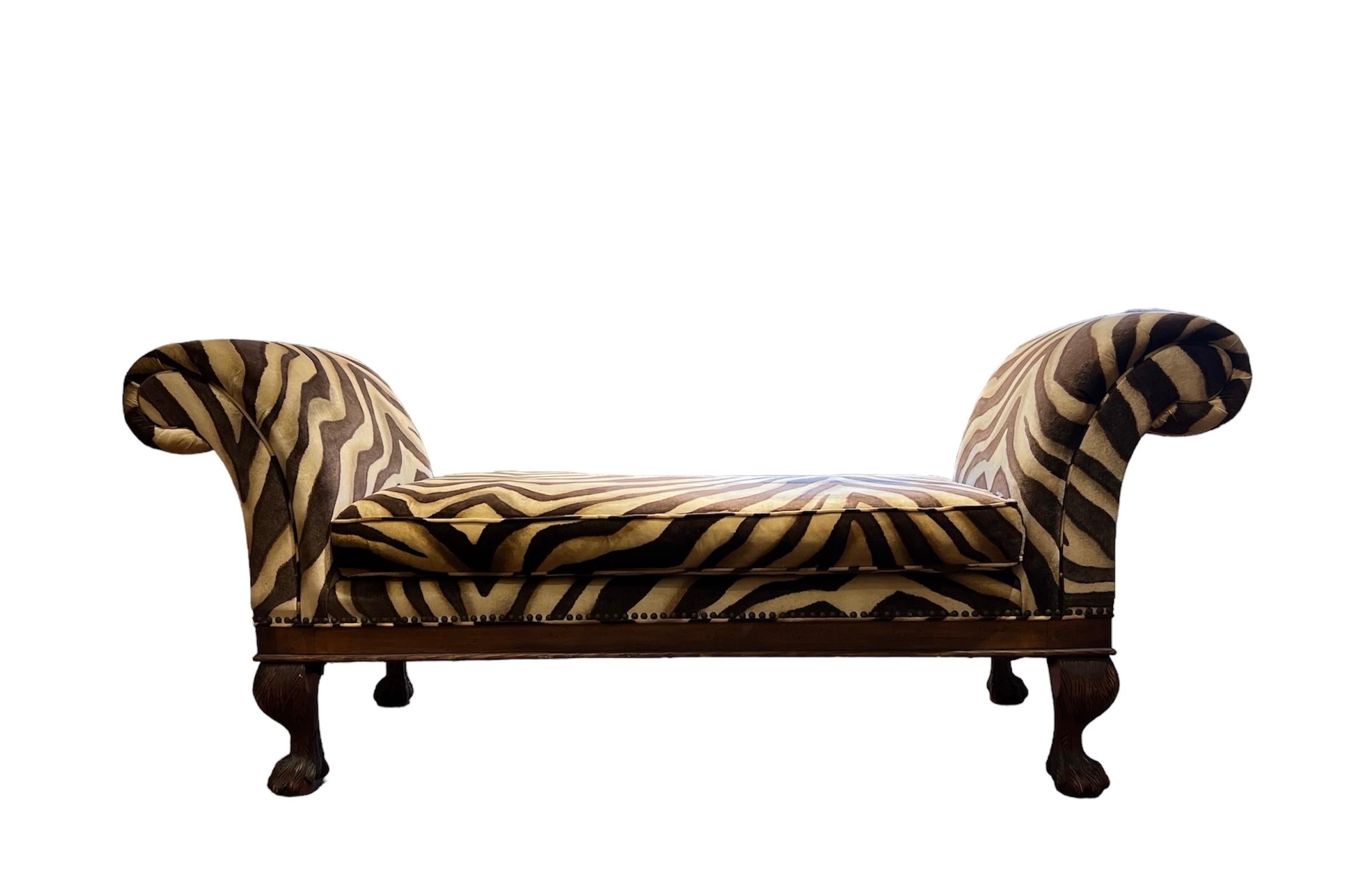 The bench is upholstered in sumptuous fabric, chosen with Ralph Lauren's discerning eye for quality and aesthetic appeal. The fabric's texture and hue exude understated opulence, lending an air of refinement to any space it graces. Completing the