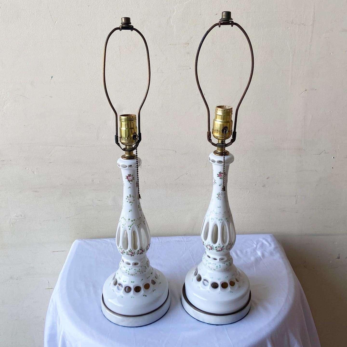 Amazing pair of vintage porcelain table lamps. Features a fantastic hand painted finish.
