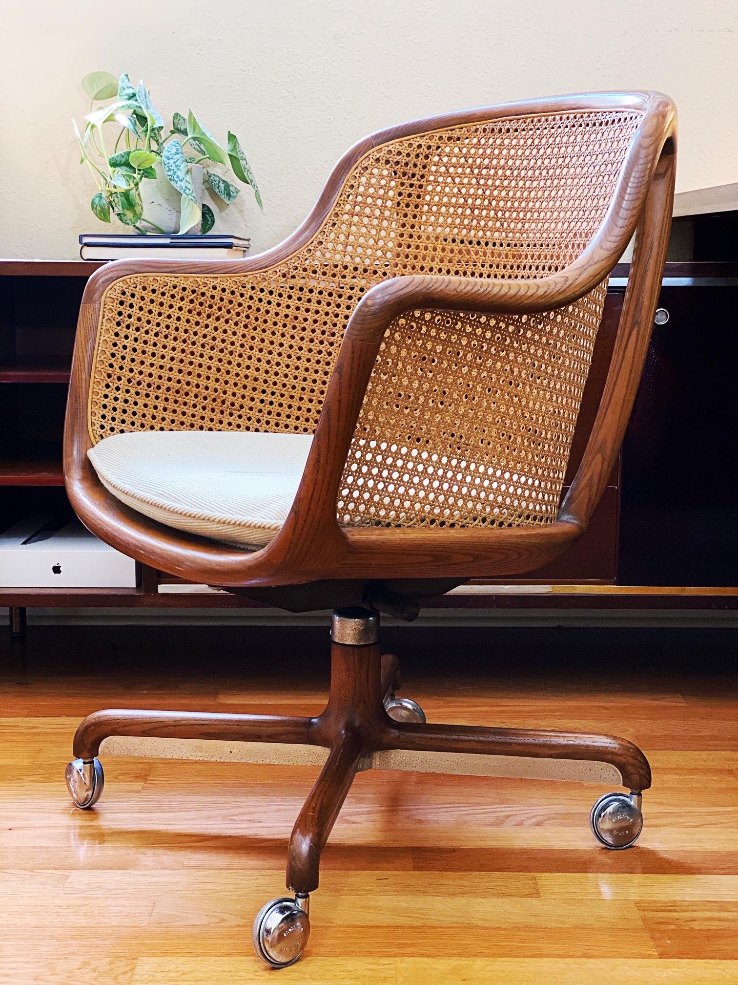 Gorgeous vintage sculptural ash and cane desk chair designed by Ward Bennett for Brickel Associates is in overall excellent condition. The chair swivels 360 degrees, has an adjustable tilt and adjustable seat height between 17-22