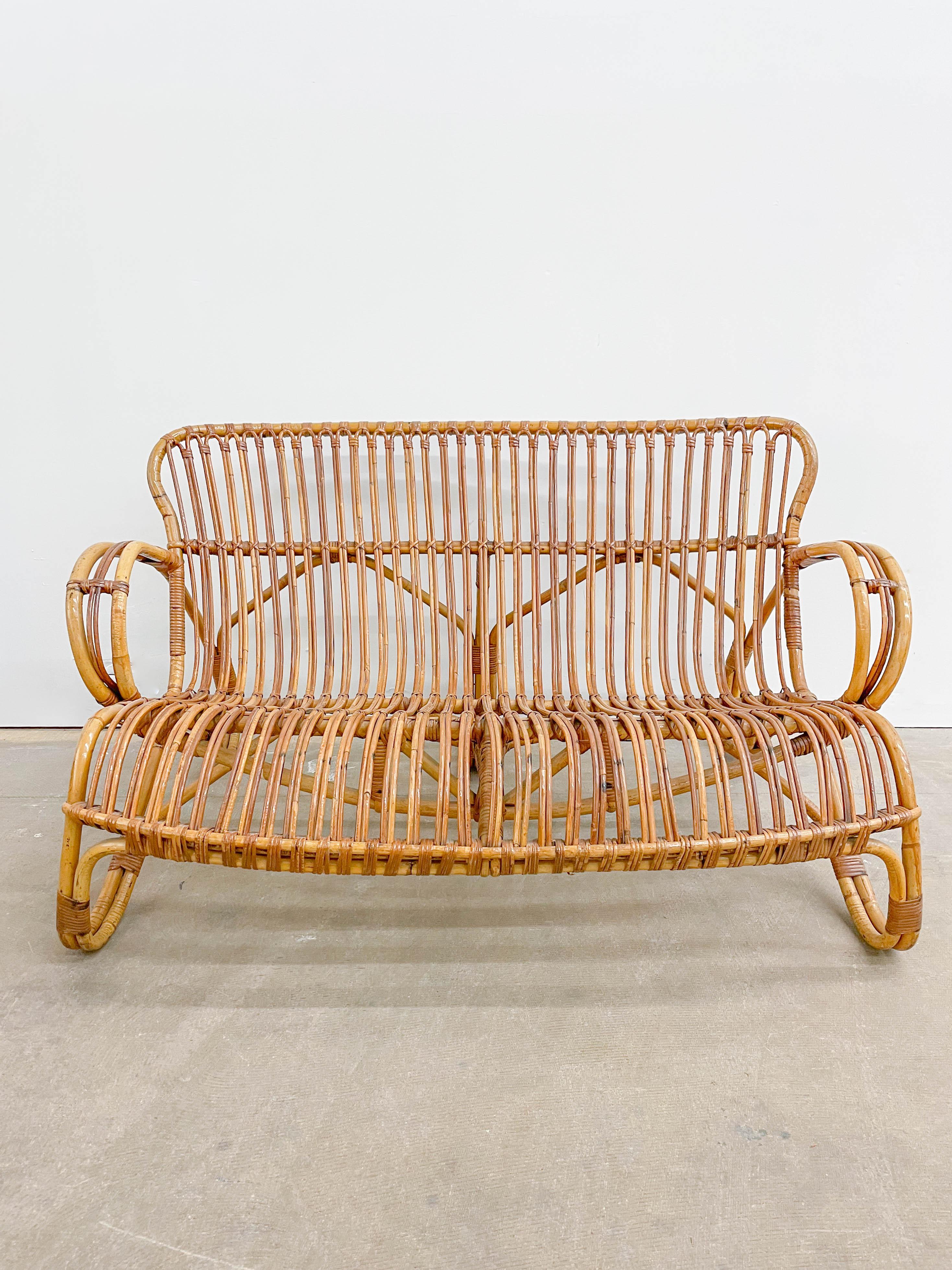 Beautifully meandering bentwood sofa with great sculptural quality by Rohe Noorwolde of the Netherlands. Expertly crafted and eye catching, this low loveseat offers lounge seating for a lighter person.
